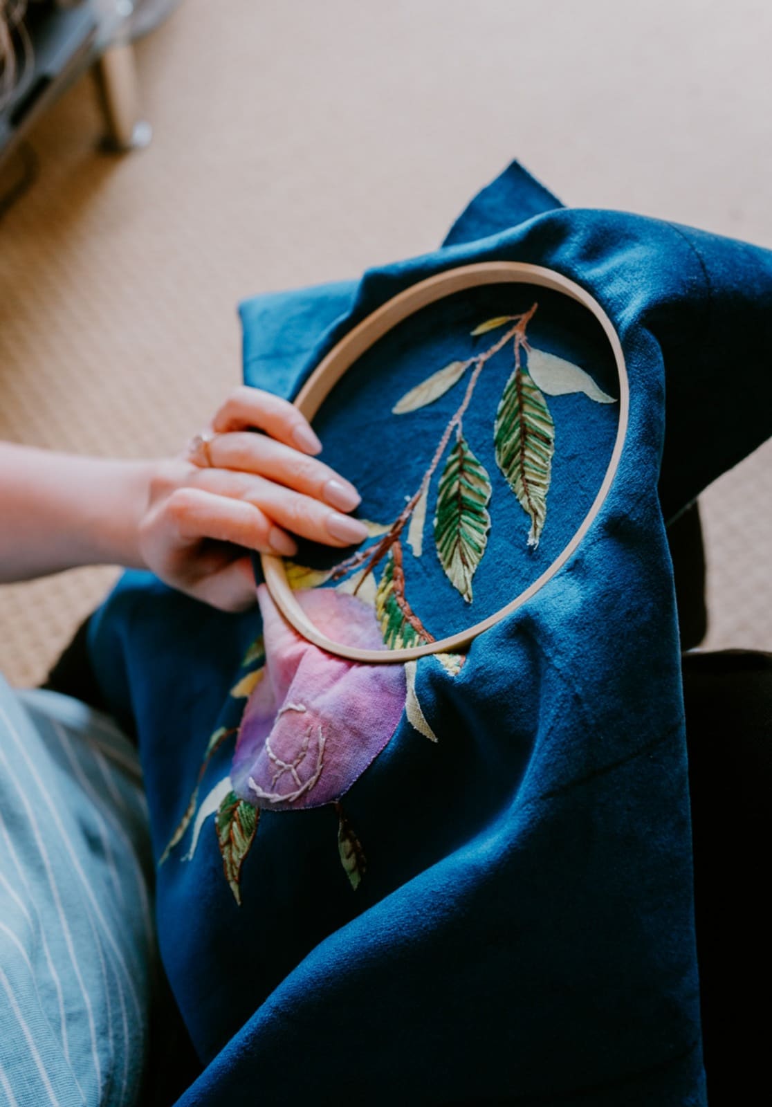 Embroidery of a pomegranate plant