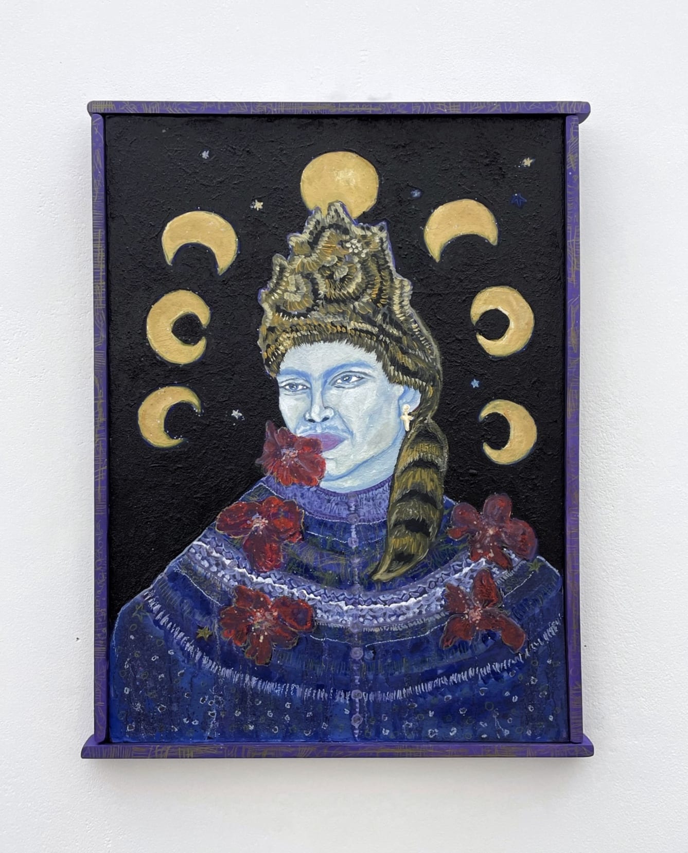 male figure in a fancy hat with fazes of the moon over his head