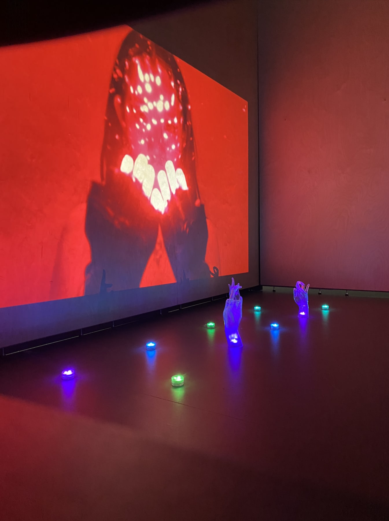 installation view of the film with the resin hands