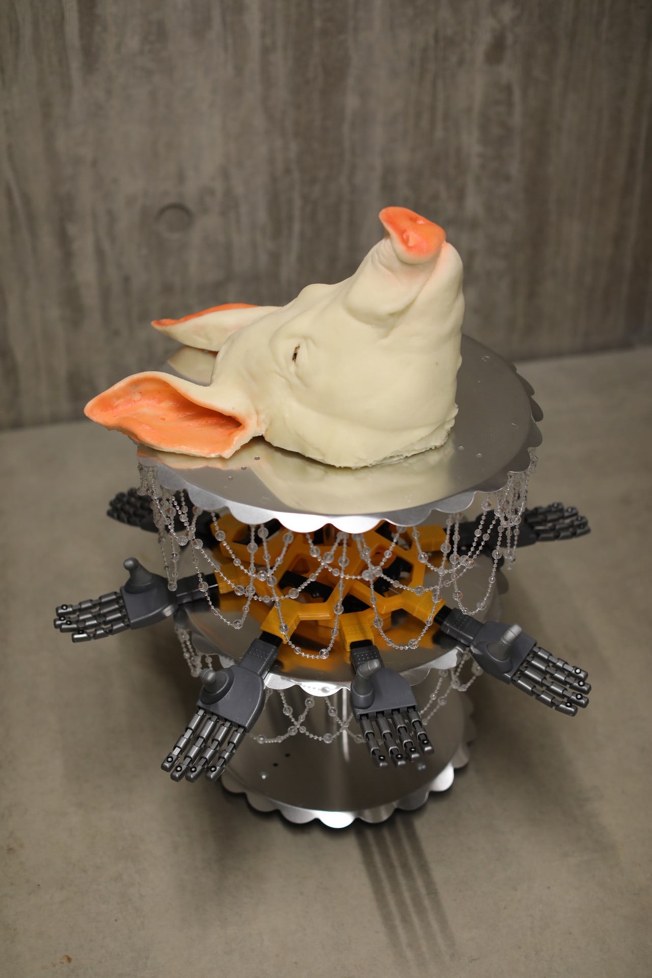 Cake stand with pig's head on top