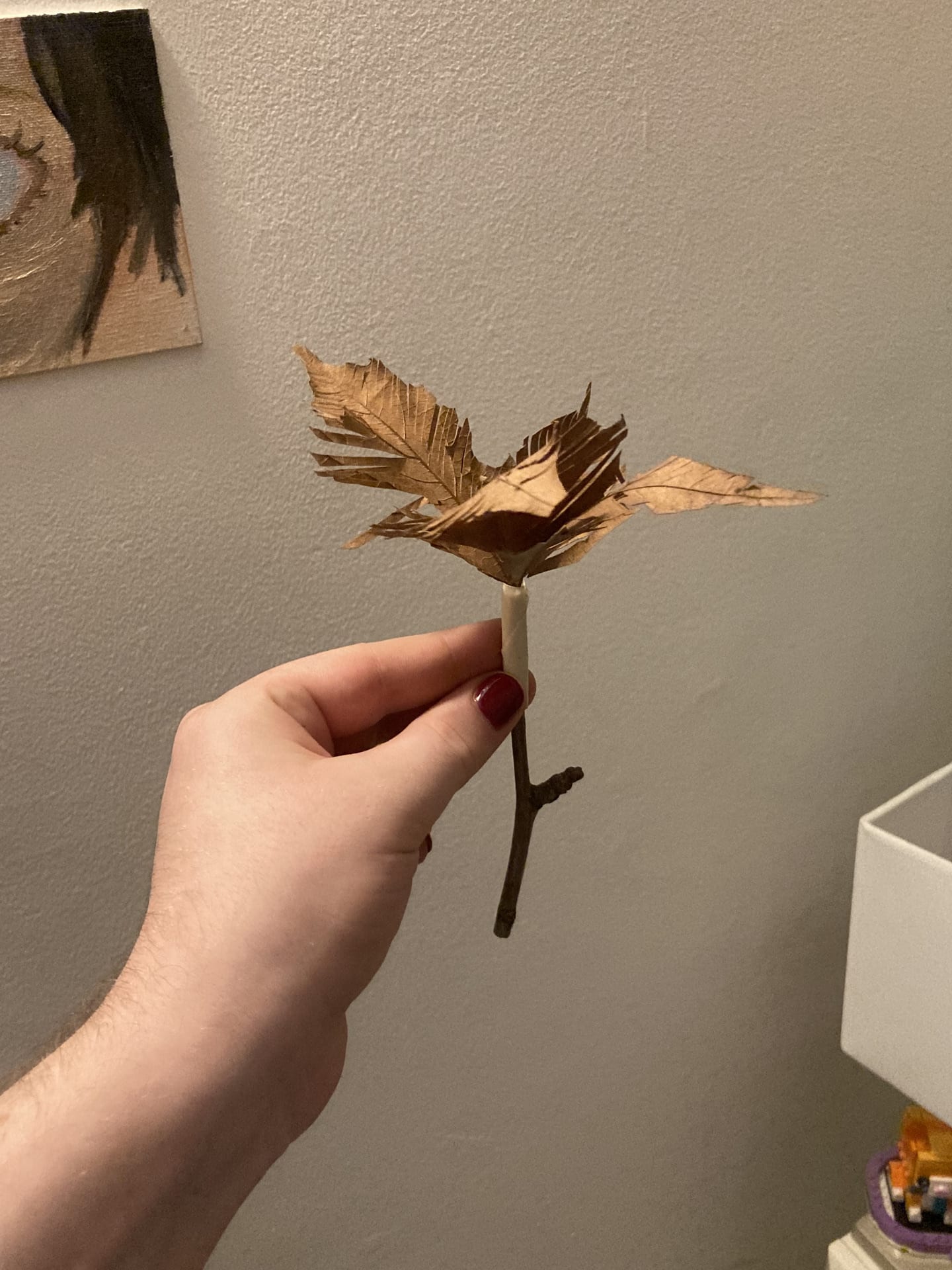 Leaves taped to twig