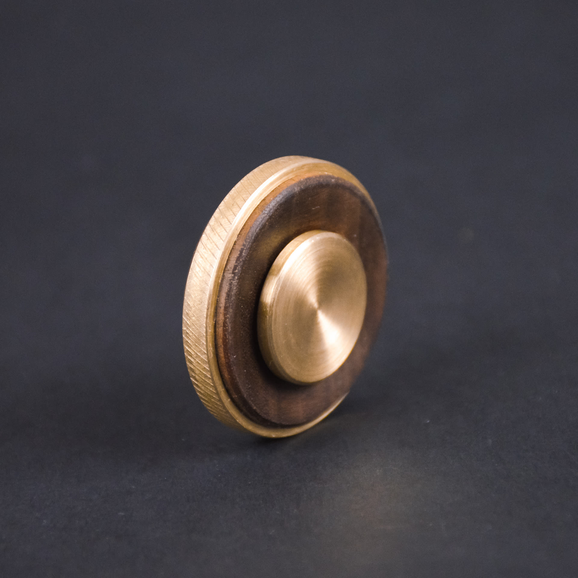 A wooden and brass coin