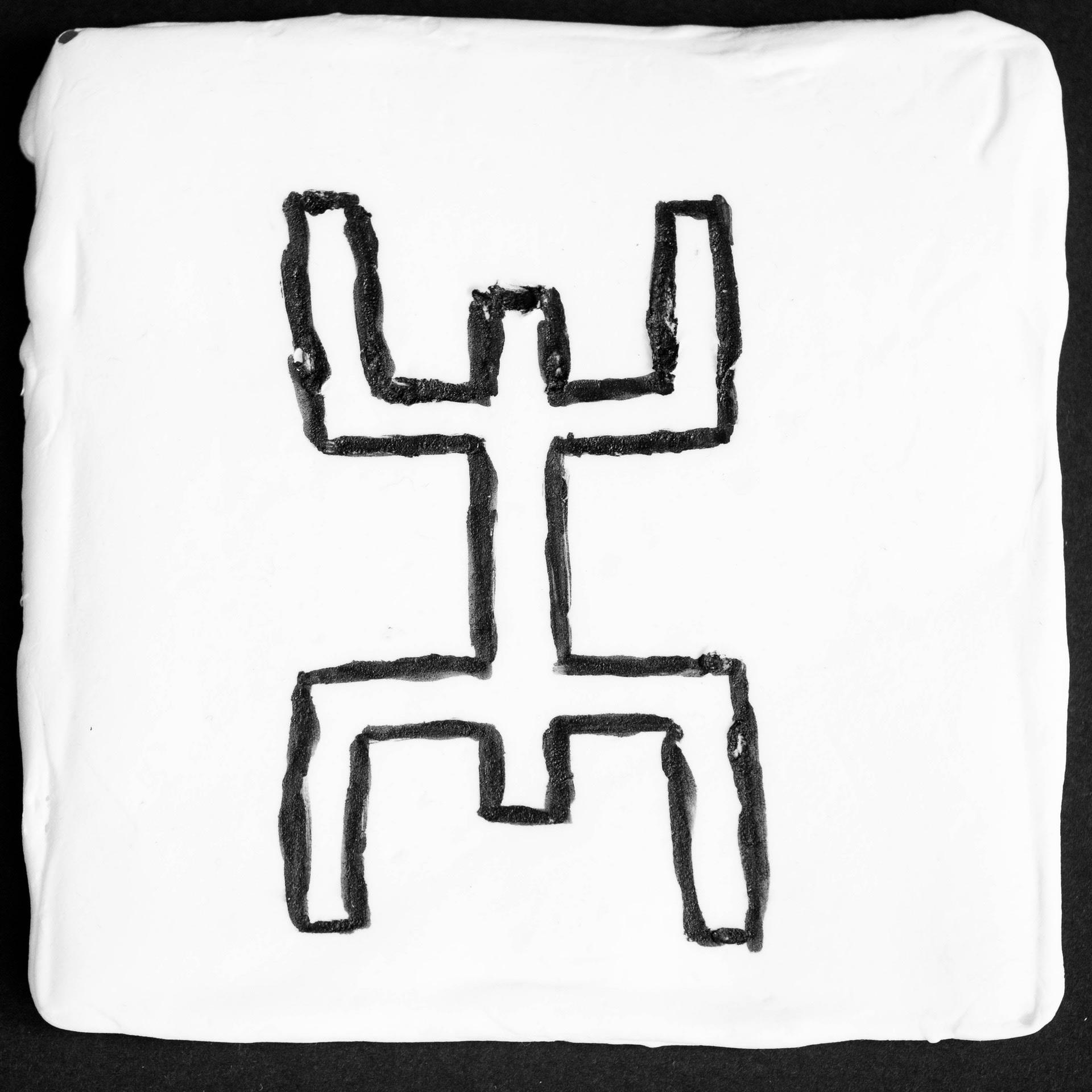 'Kanaga'- image from the series 'Sirius'.A debossed scented white clay tile of Kanaga, symbol of the structure of the universe