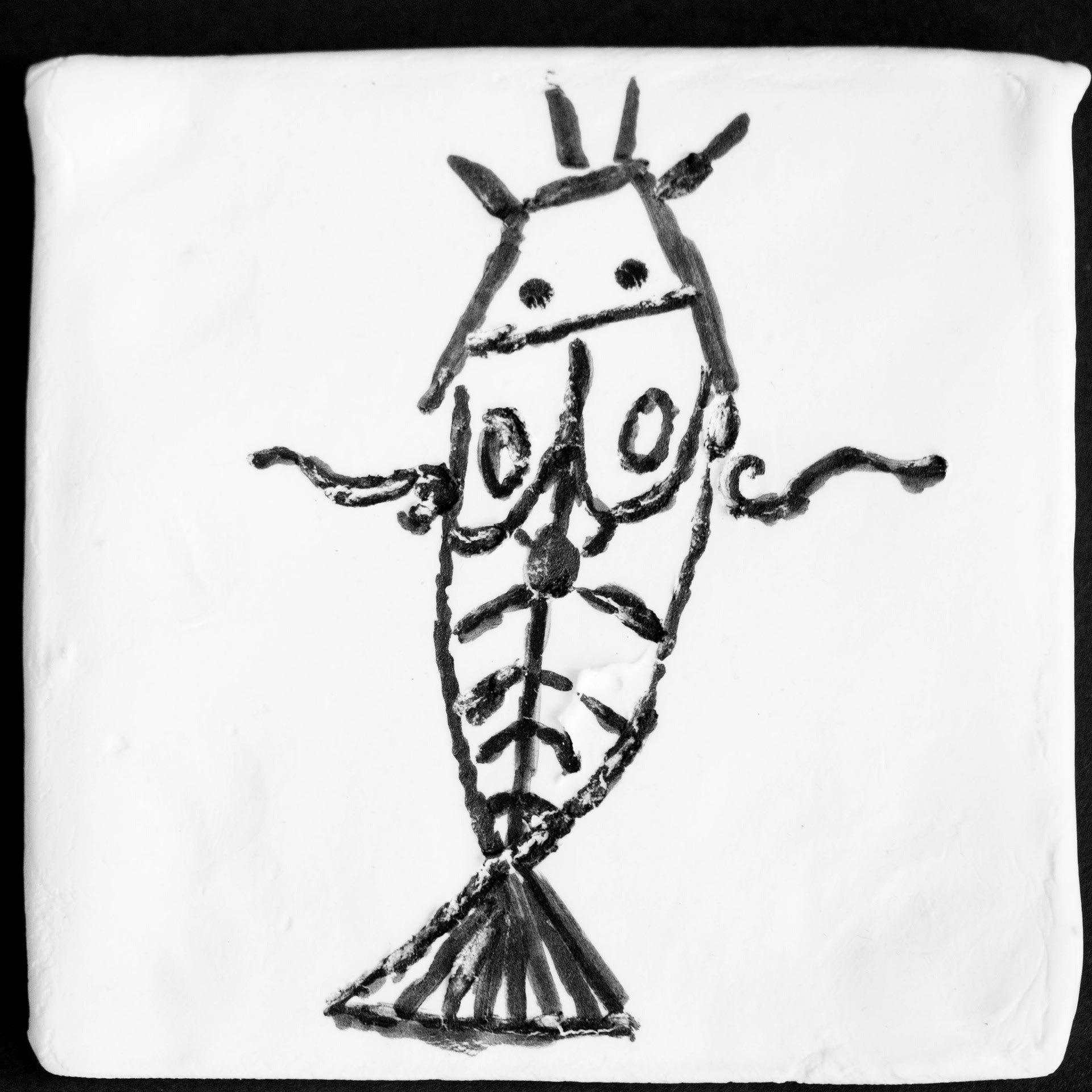  'Nommo'- image from the series 'Sirius'. A debossed scented clay tile  image of Nommo: symbol of the mermen .
