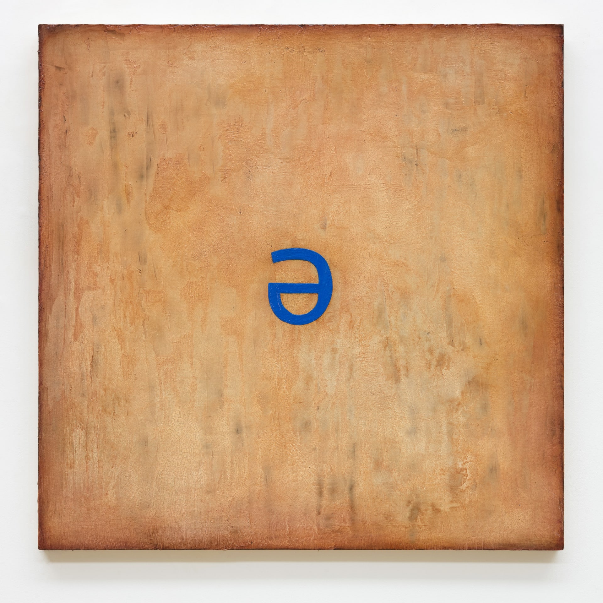 A neon blue schwa floats in the centre of a burnt-orange acrylic ground.