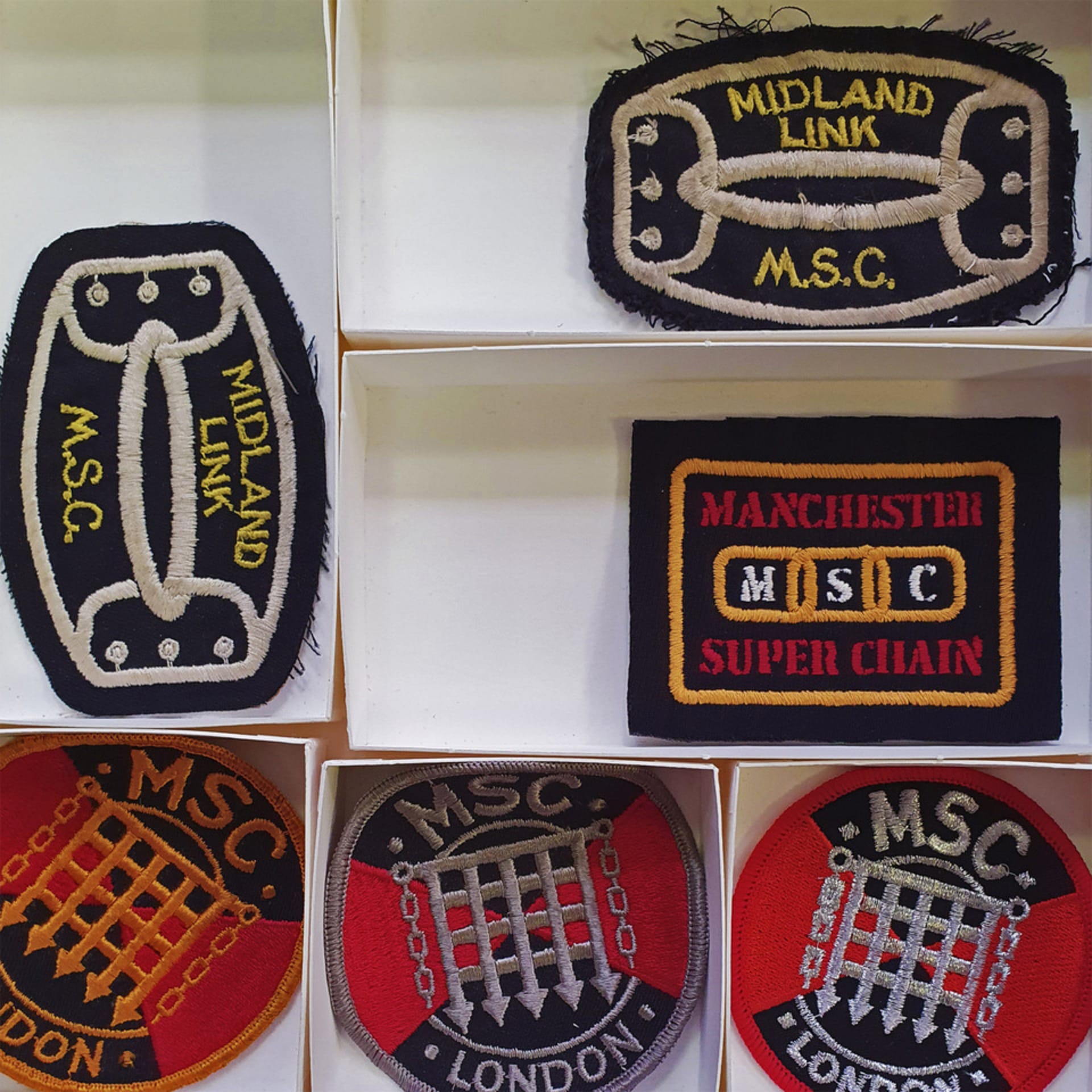 Photograph of patches belonging to multiple leather clubs