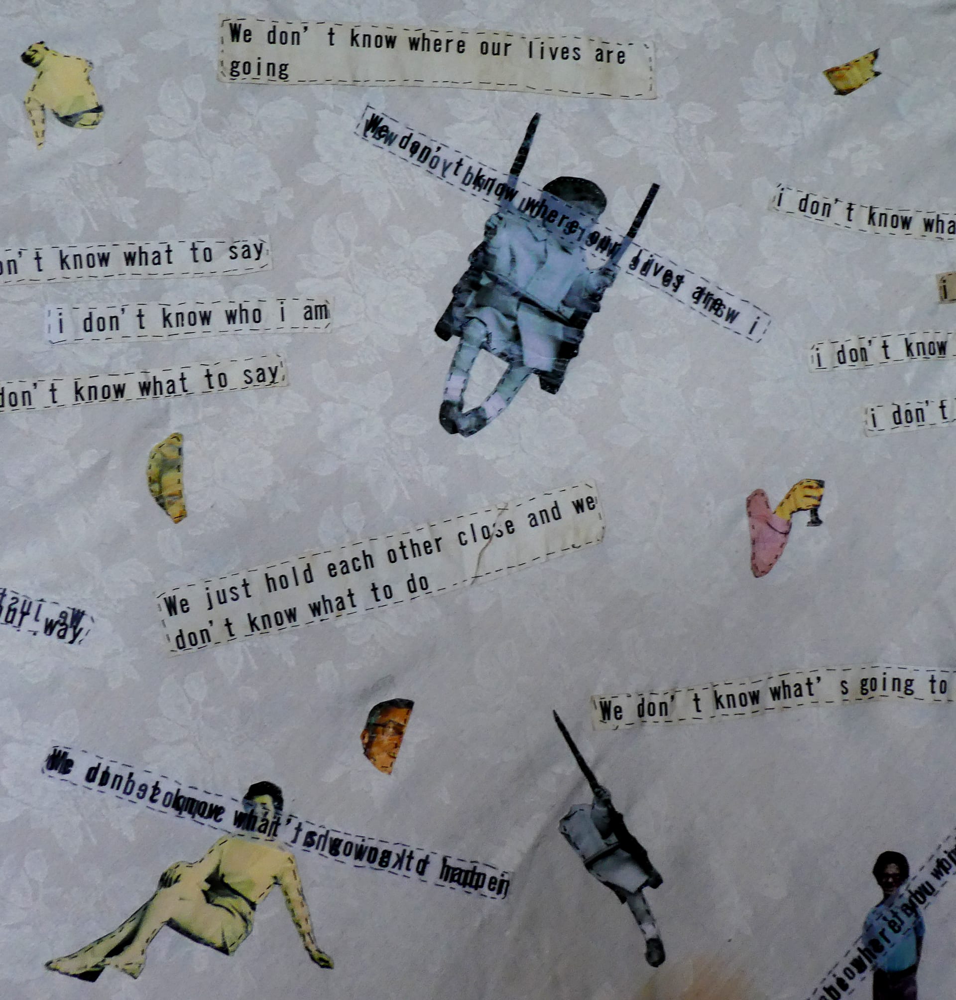 Tablecloth detail - hand-stitched text and fragmented images of family photos cut up 