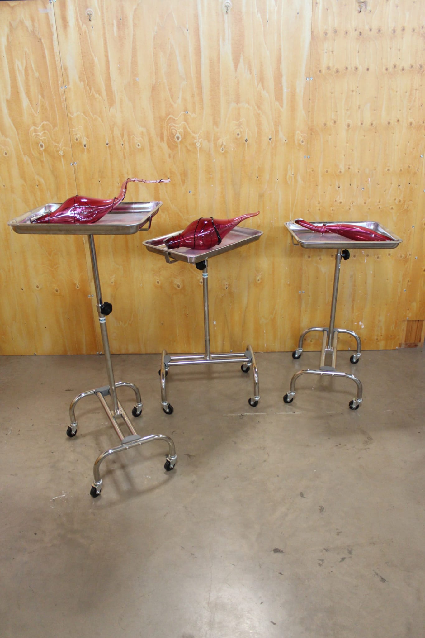 three medical trays used a pedestals for pick blown glass