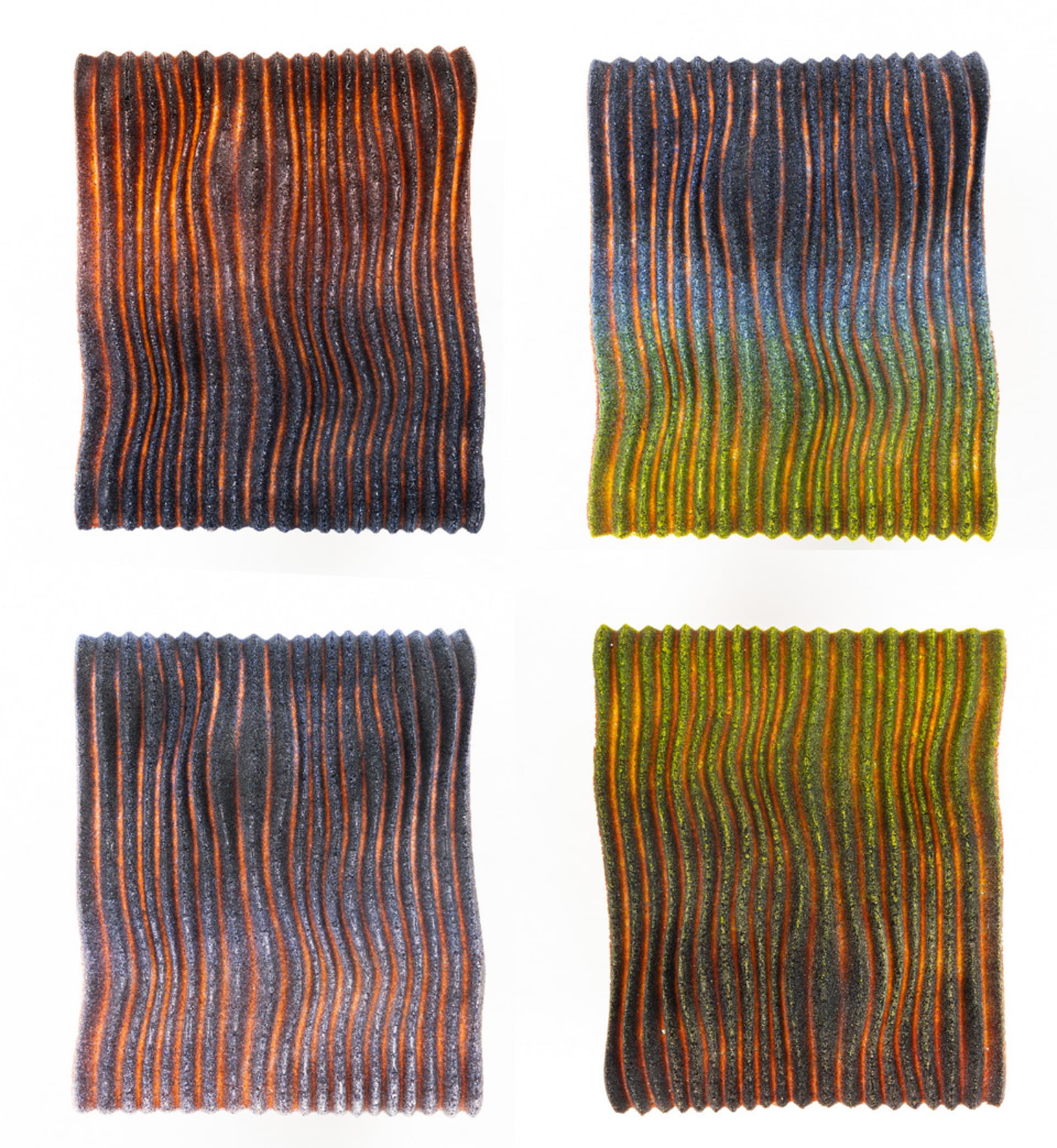 Four panels of waves made from glass - transitioning through different colours from dark blue to lilac, to green to coral.