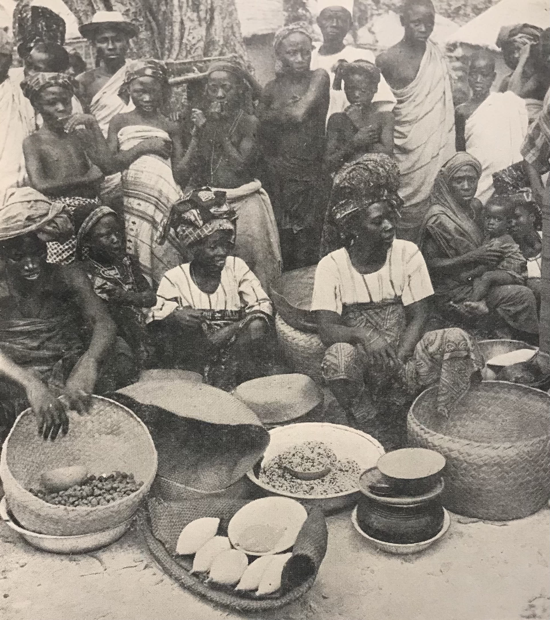 market scene, girl second from left wears wax print 