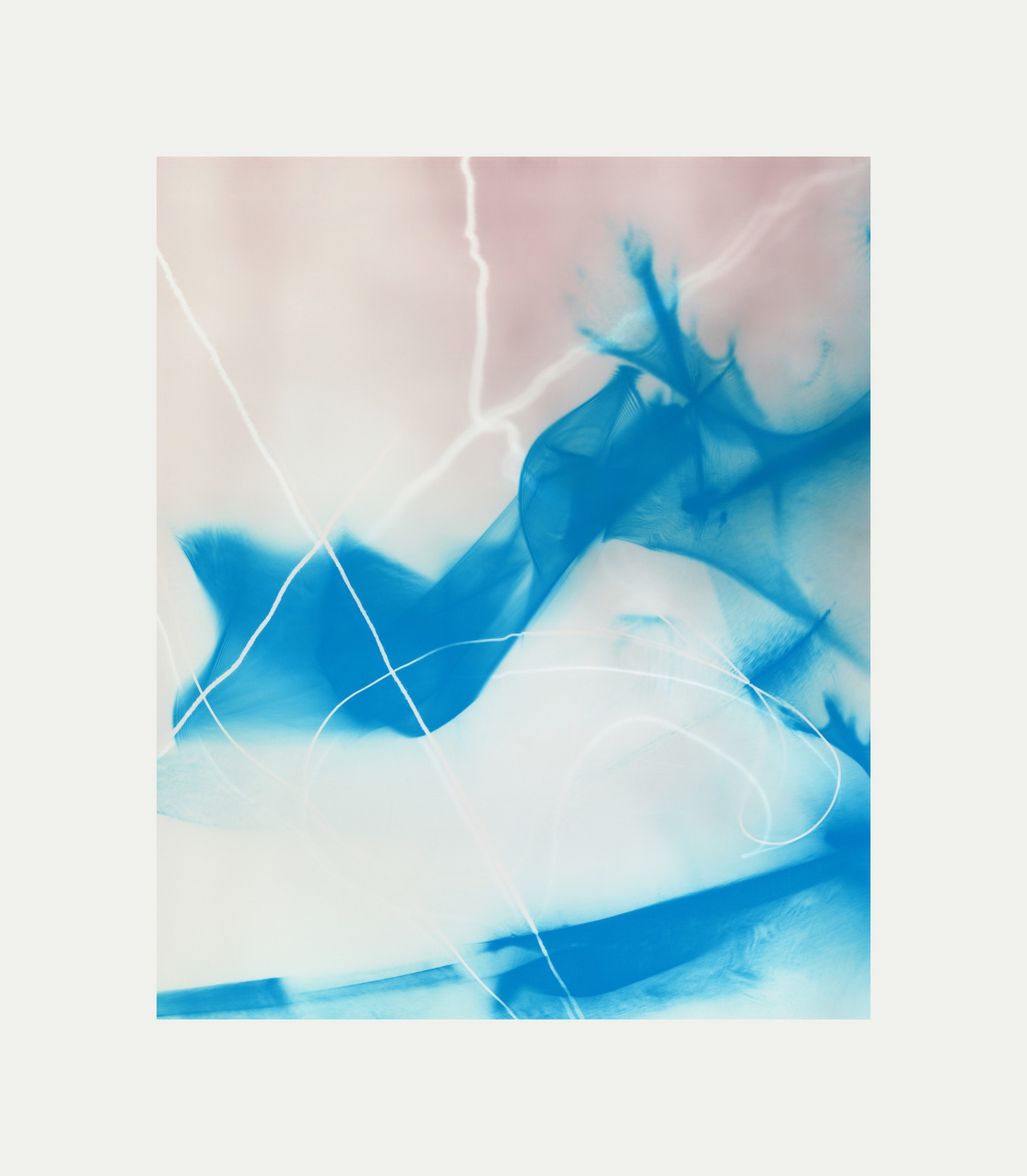 An abstract photogram with a pale pink blurred background with an organic blue flowing form with white thread like lines weaving