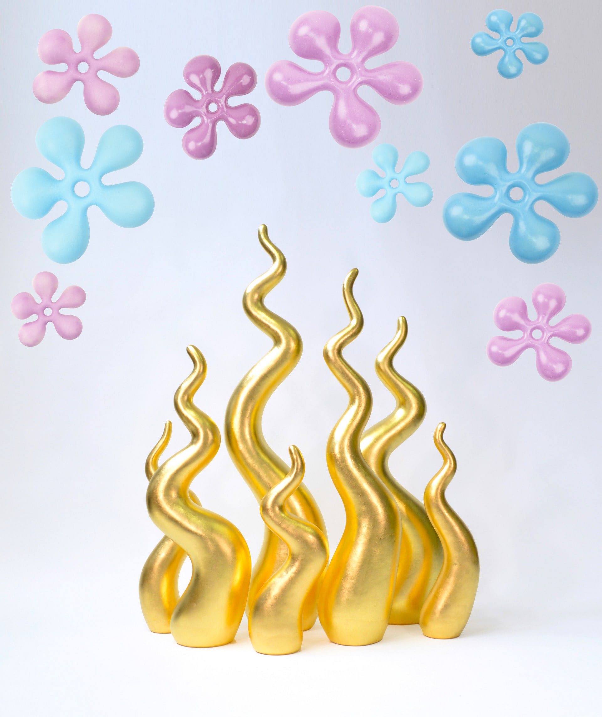 Seven tongued gold gilded flame sculpture with Sky Flowers overhanging