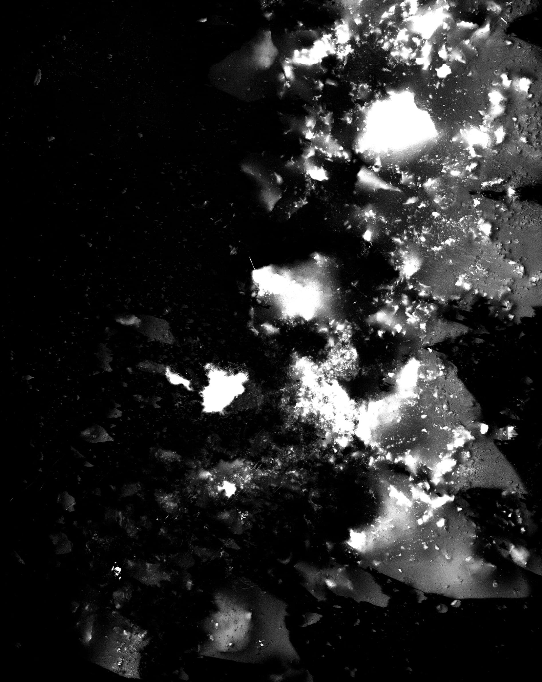 Black and white photogram of chalk being crushed into 5x4 Negative 