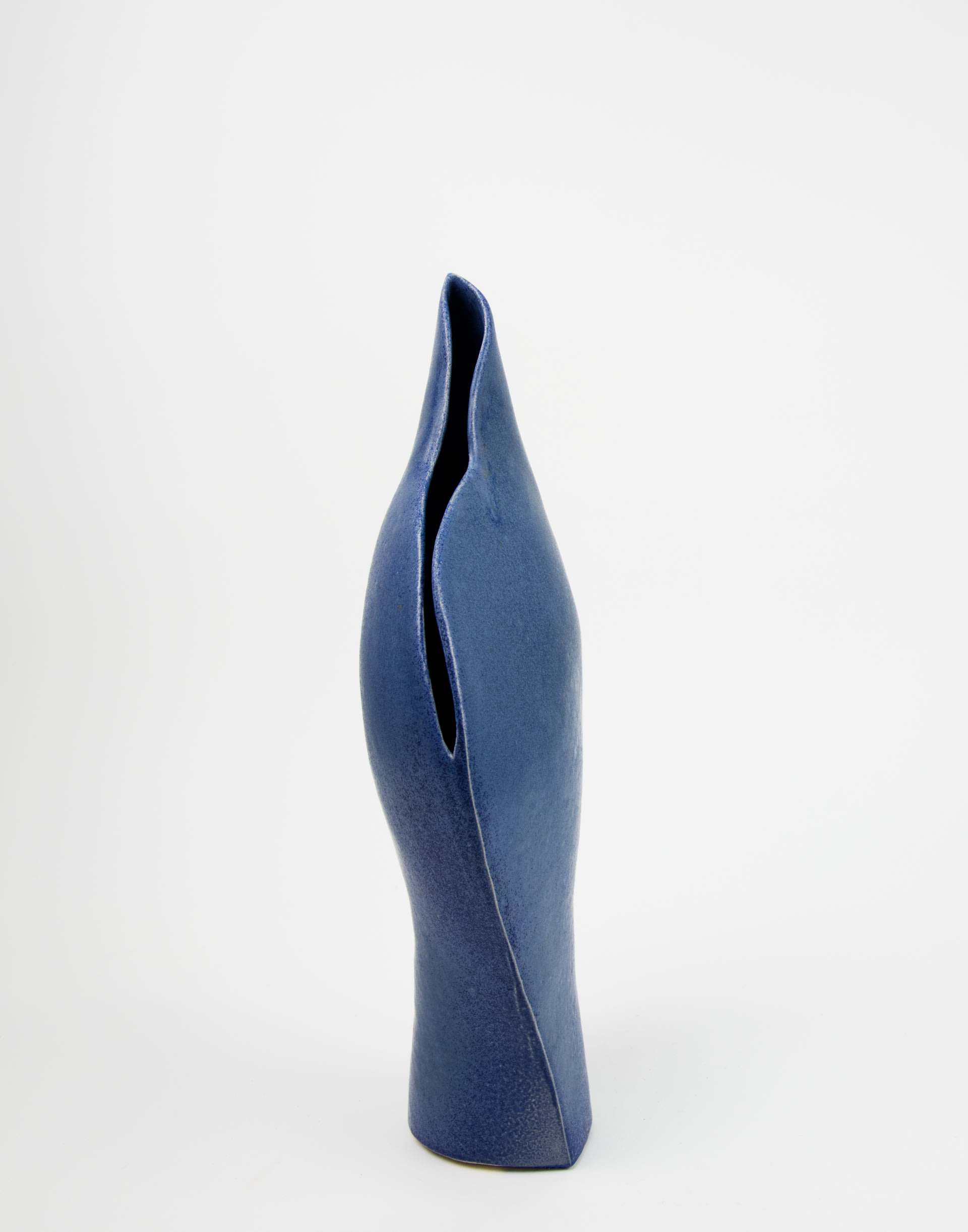 a blue curved ceramic vessel