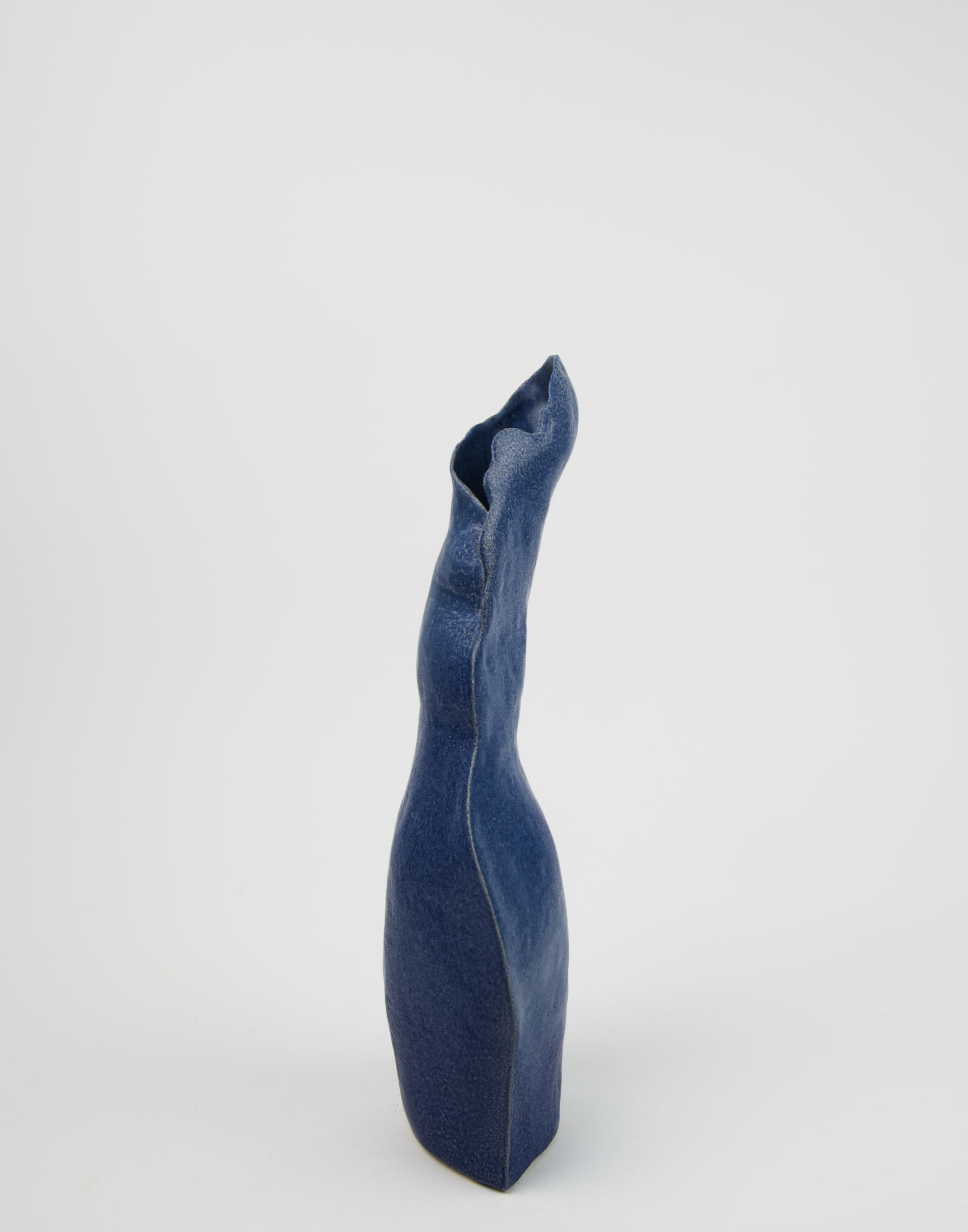 a Dark blue curved ceramic vessel