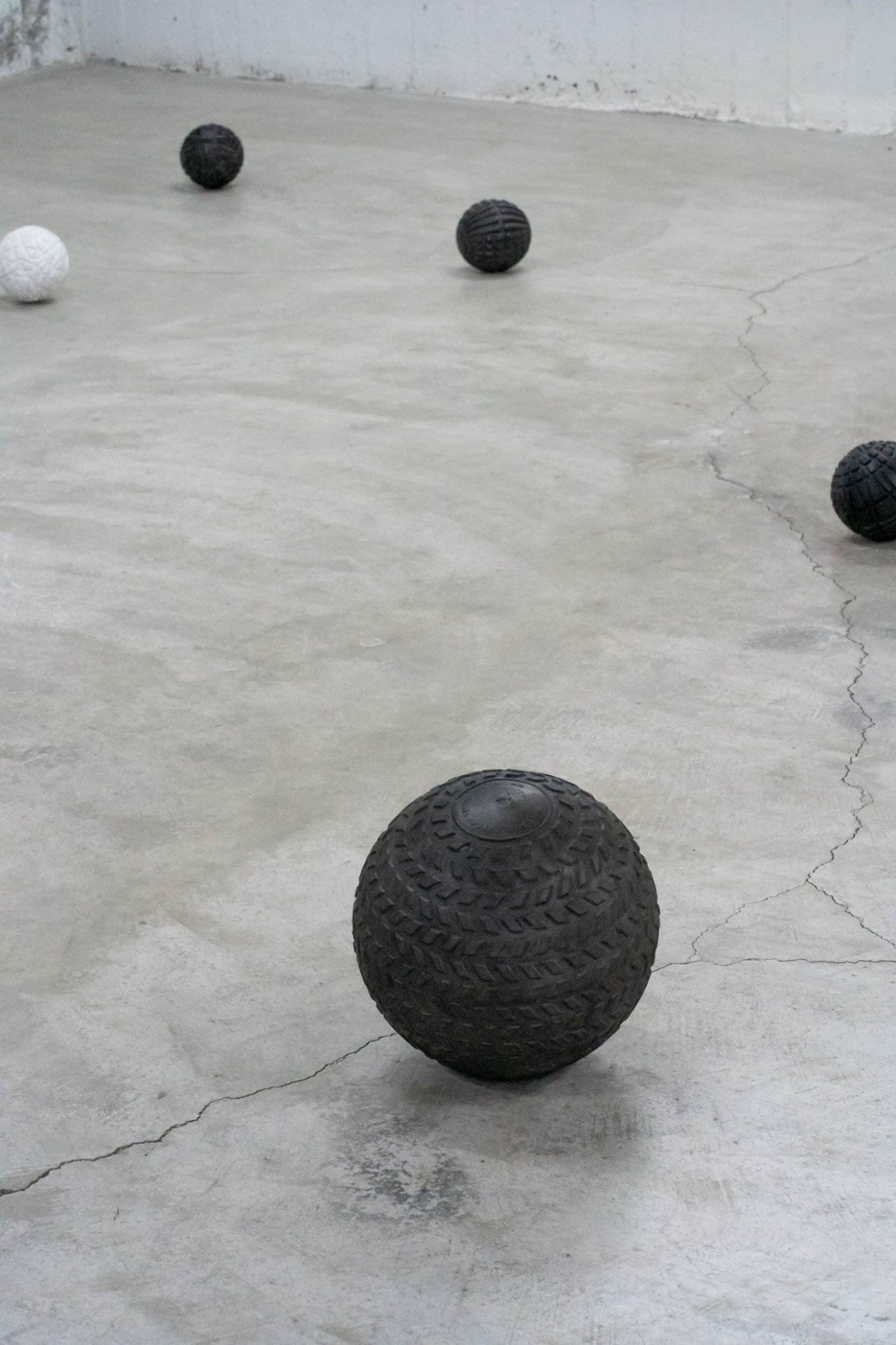 Muscle balls , installation -variable dimensions, 9 plaster spheres, testosterone powder