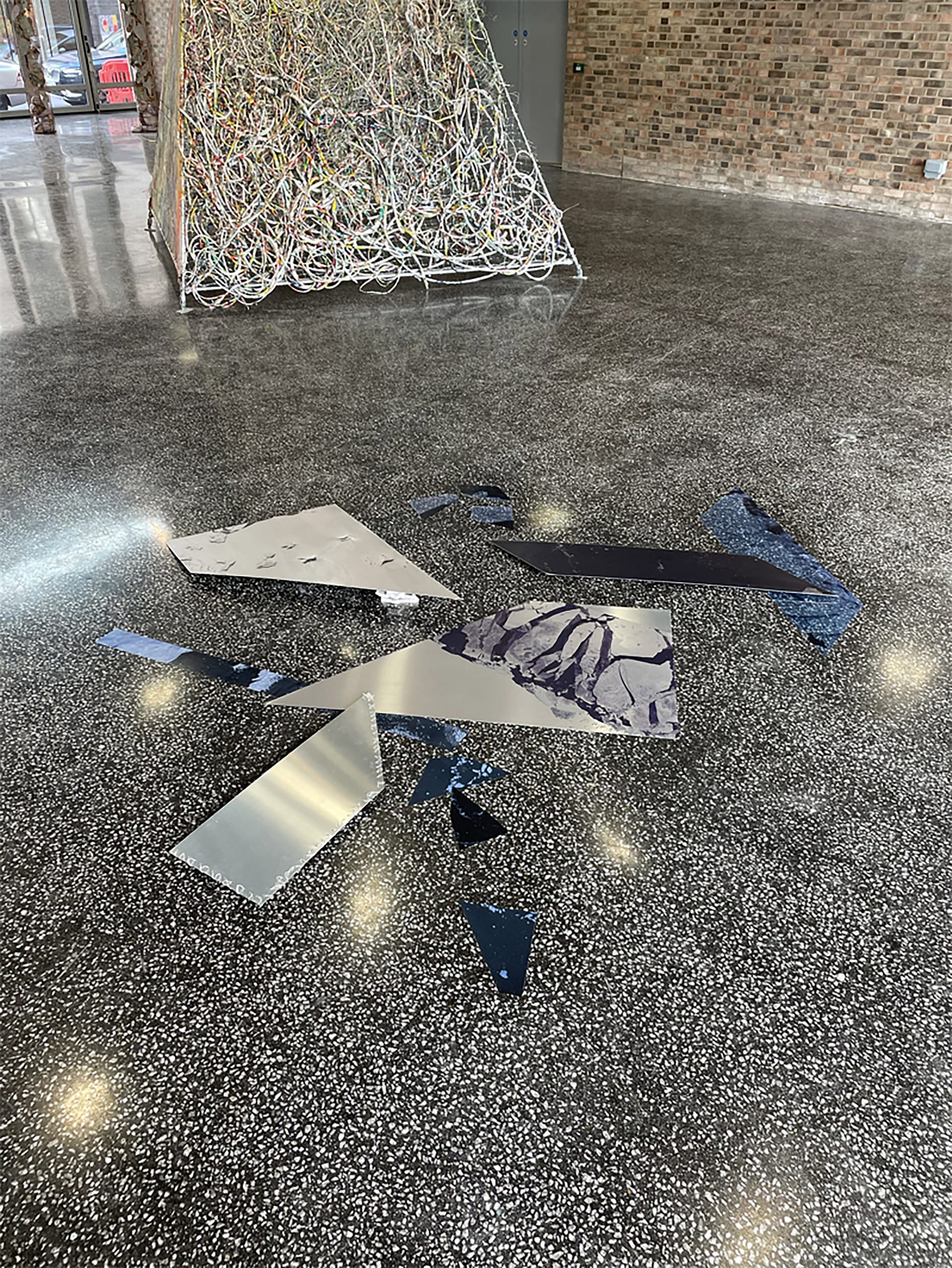 aluminium shards on the floor with icy print on