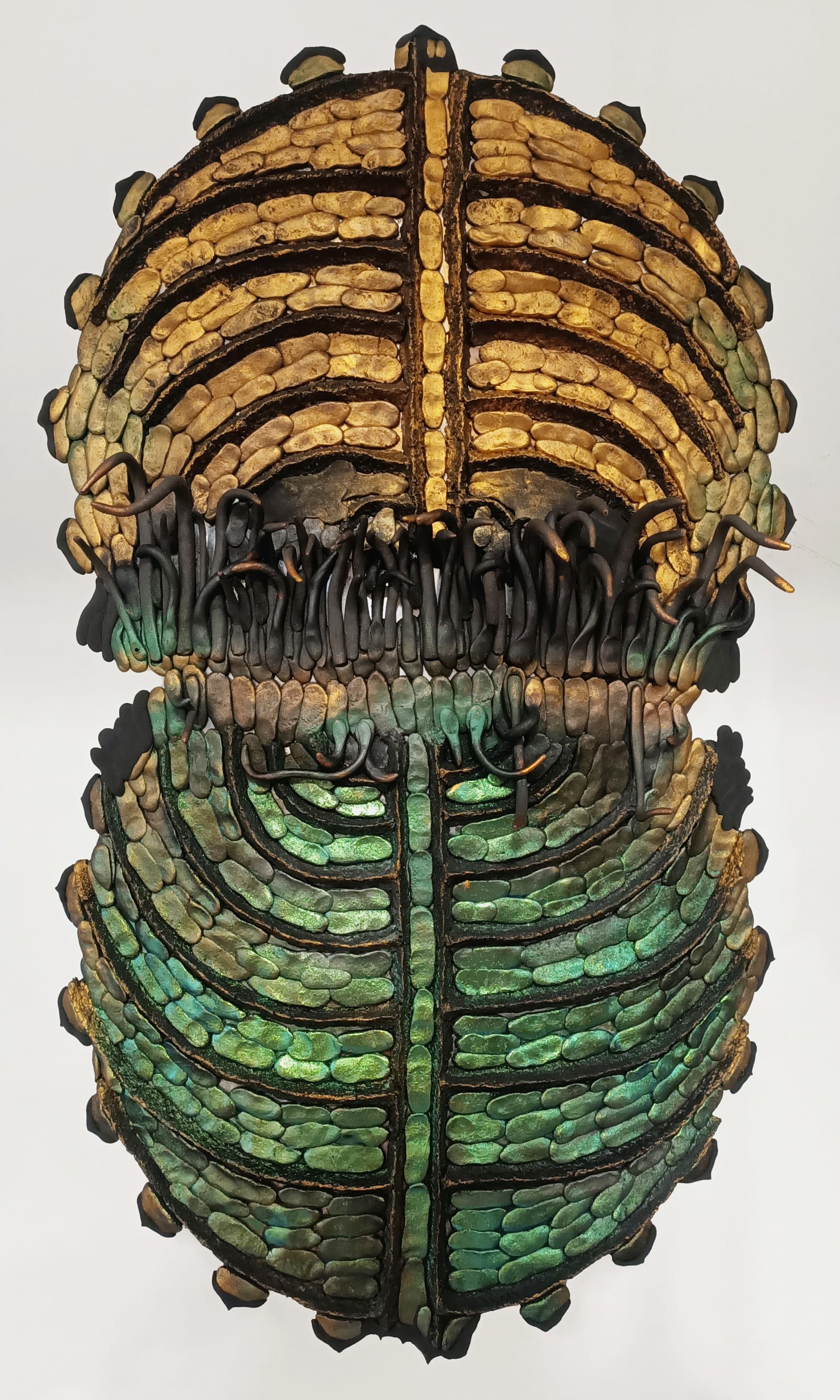 Beetle shield in green. Aluminum, foam clay, epoxy clay, retoration powders and waxes, graphite. 50 x 25 x 50 cm. 2023