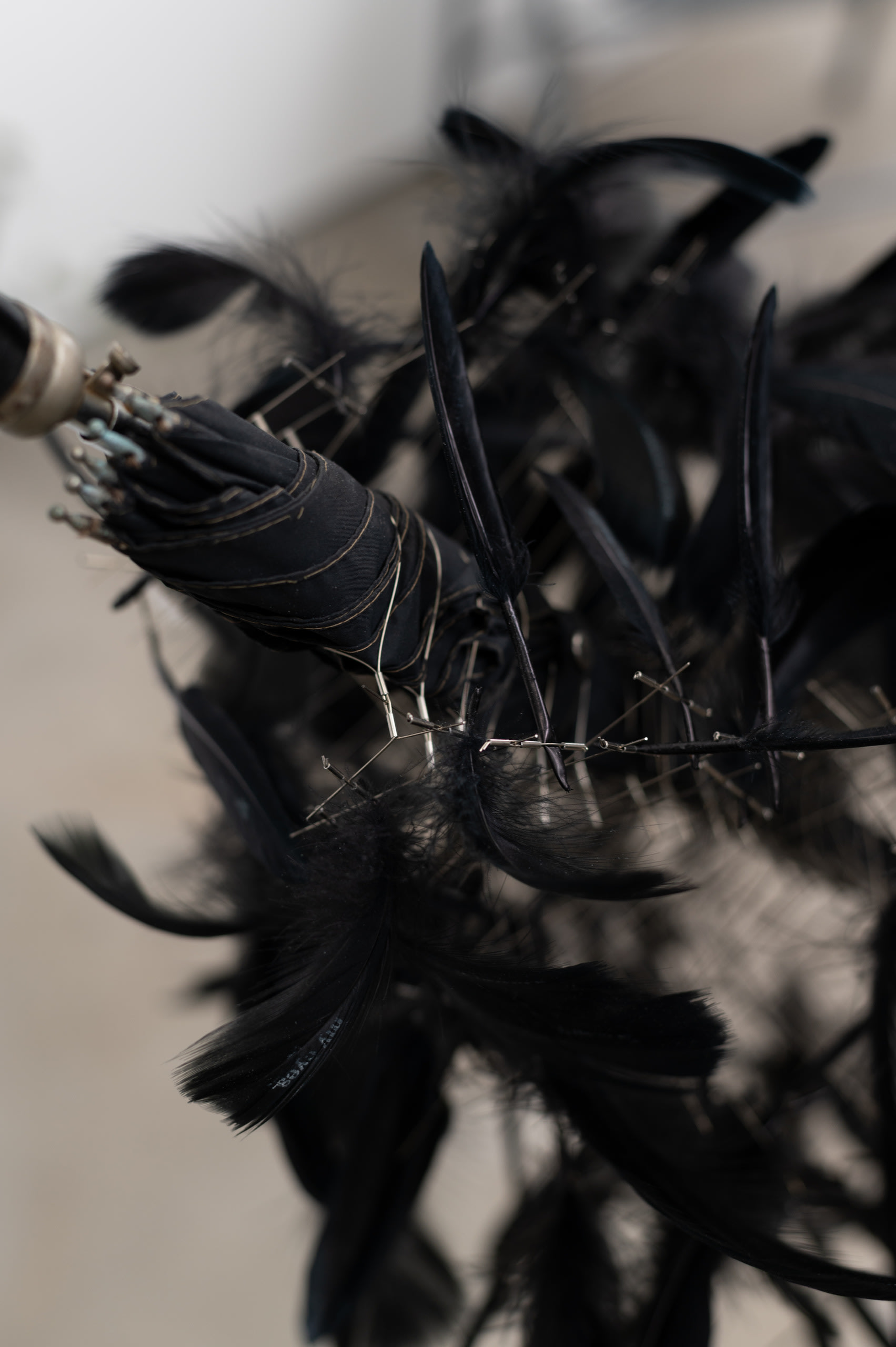 'My body is a tool...', Umbrella, stainless steel wire/tube, black feather