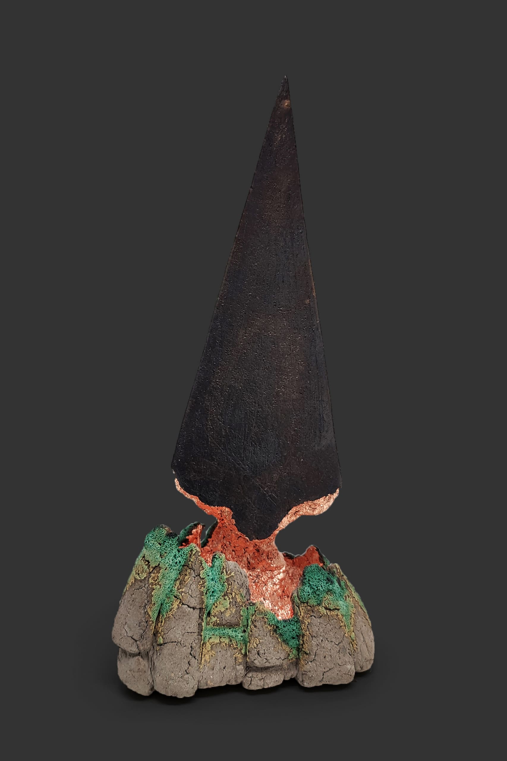 An image of ceramic sculpture by Chloe Lennon with metal copper leaf and volcanic glazes representing nature and industry. 