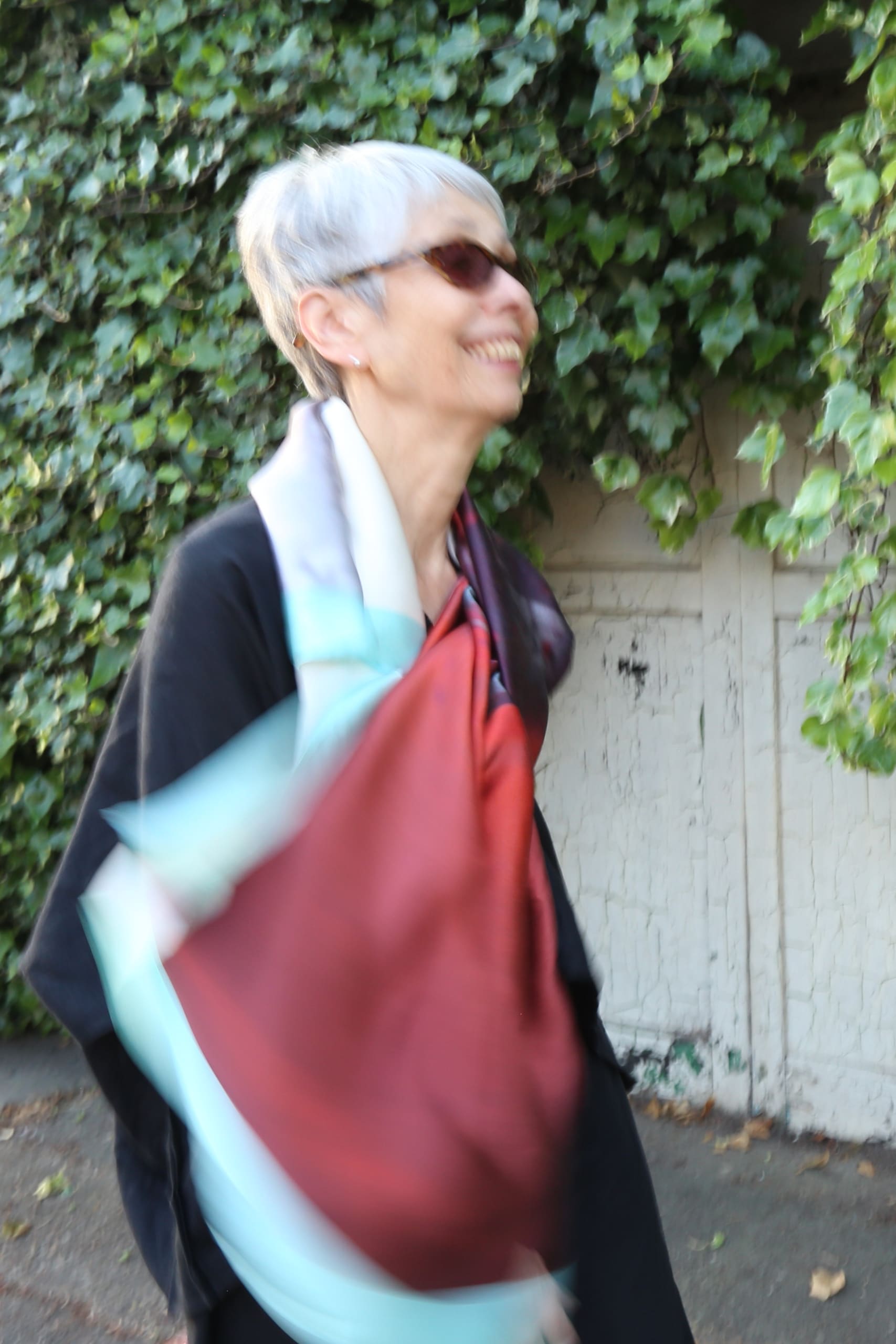 The older model wears a silk scarf printed with an image of a classic car taken in Havana, Cuba