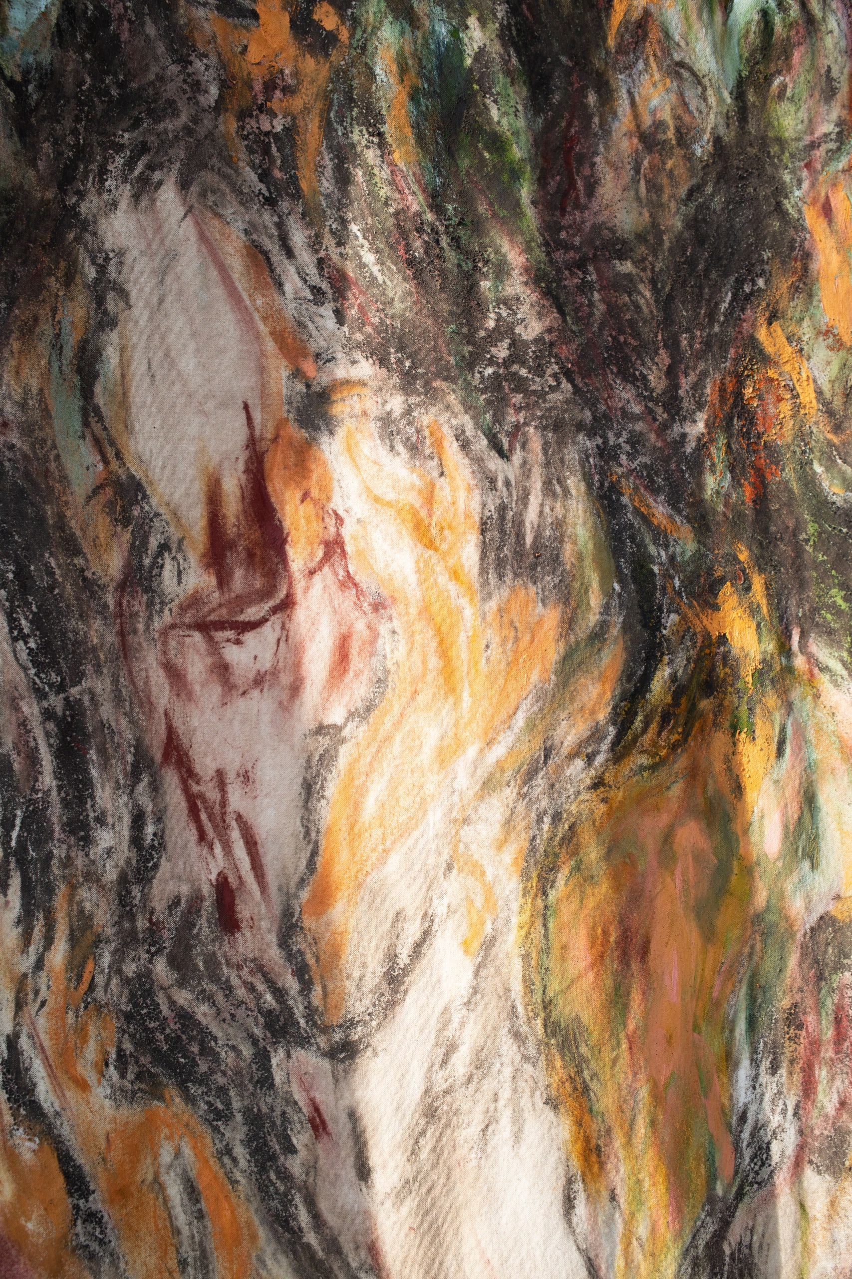 close up of tapestry, traces of yellow, red, green and dark river clay 