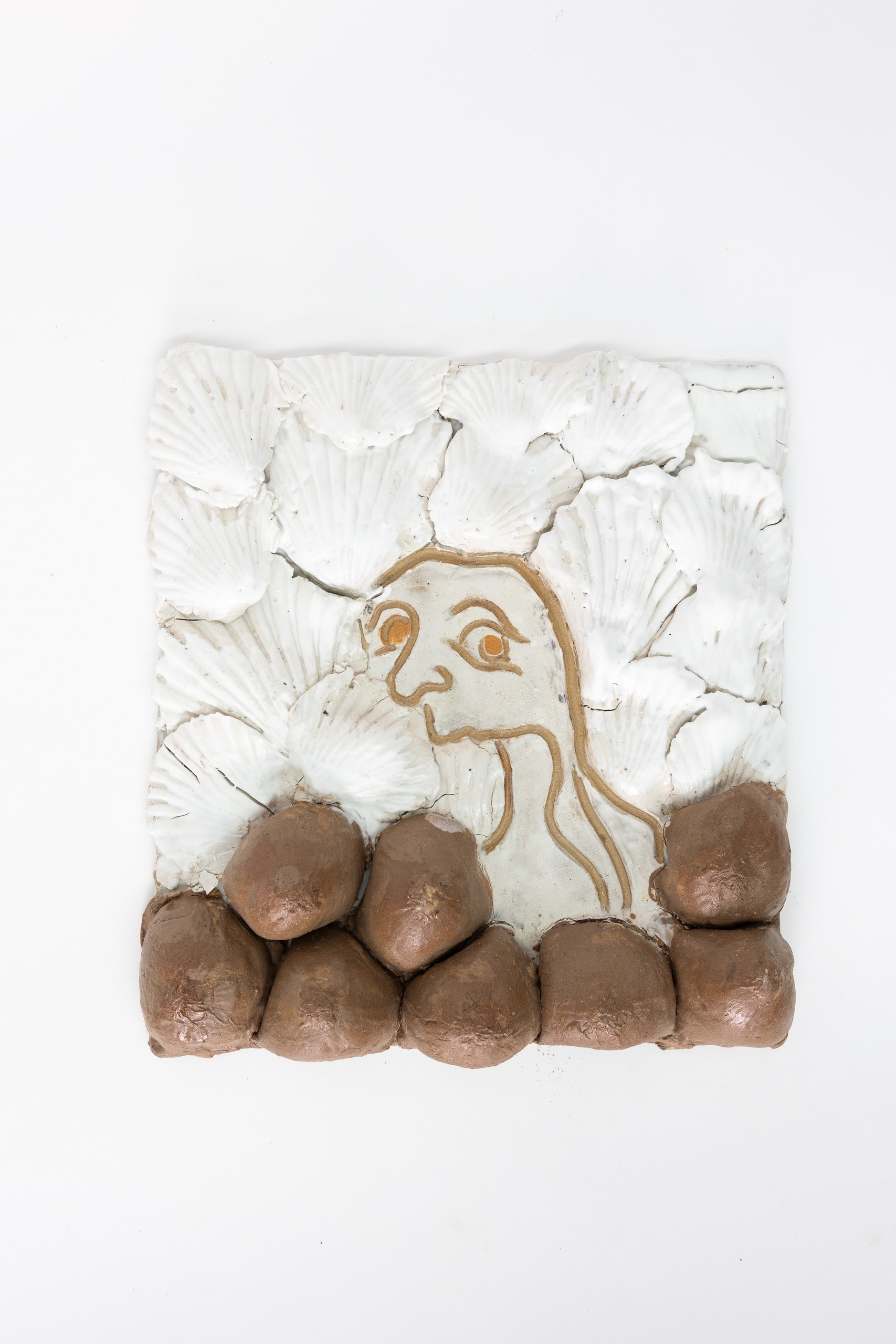 Tile, portrait of a person surrounded by shells and onions