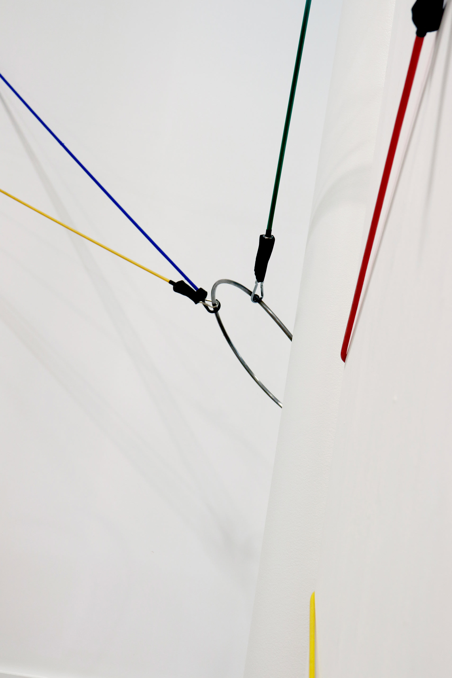 Rubber resistance bands and hoops tautly suspended across a space