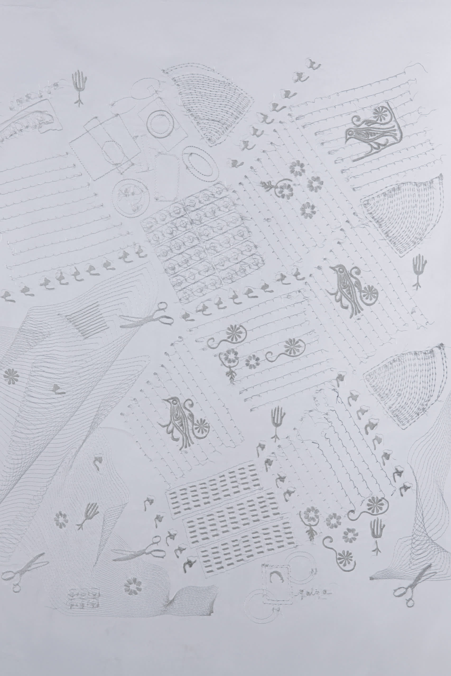 Embroidery sampler showing symbols from the site