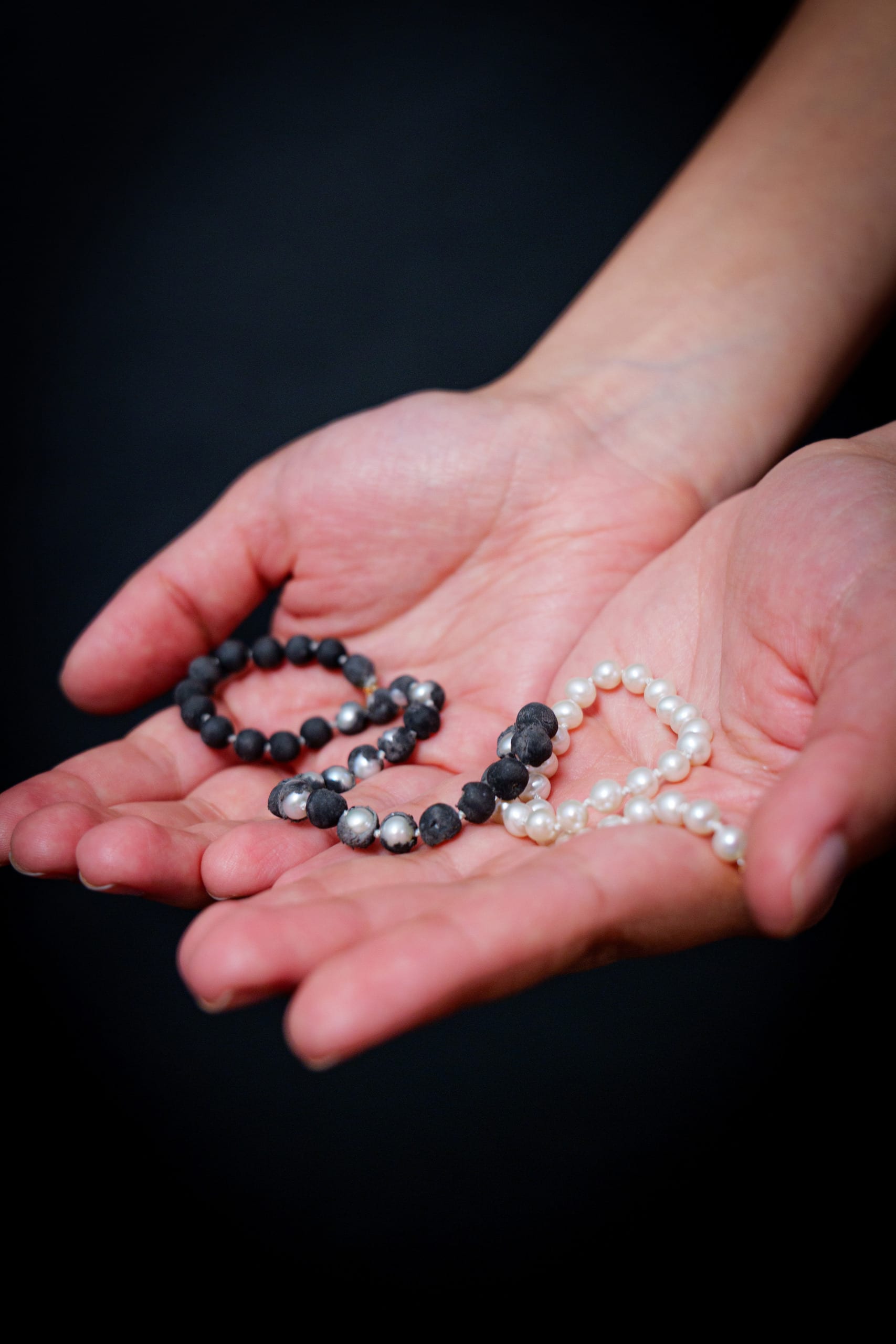 Pearl necklace-some pearls are incased in black handmade erasers