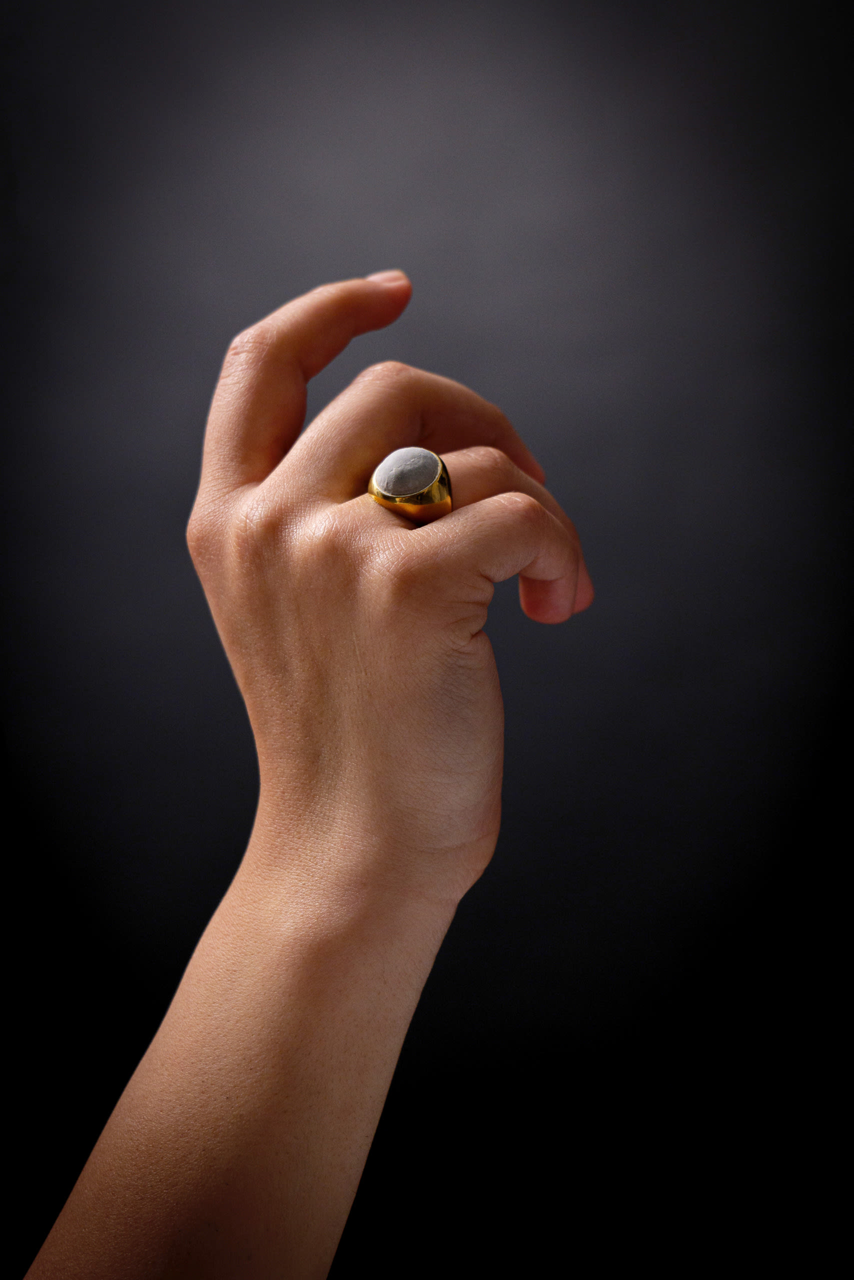 signet ring with a stone made from erased words(eraser)