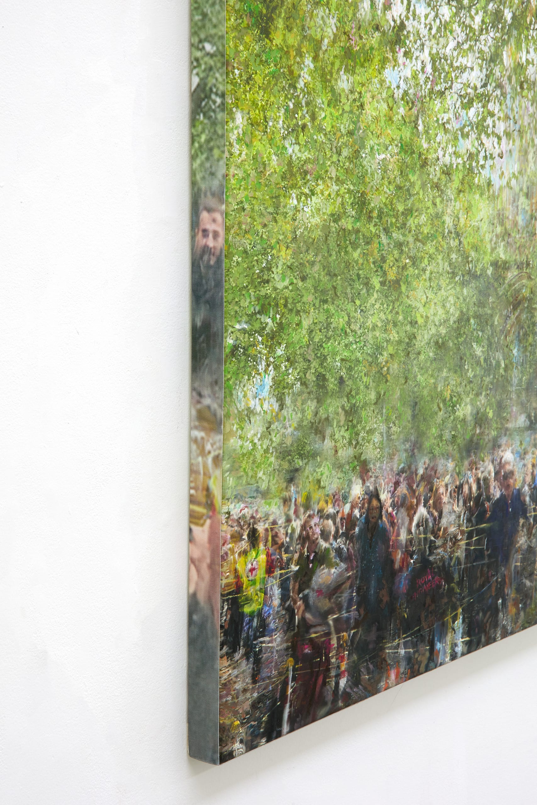 A distorted image of crowds of people under a layer of green trees, digital collage of photographic material.