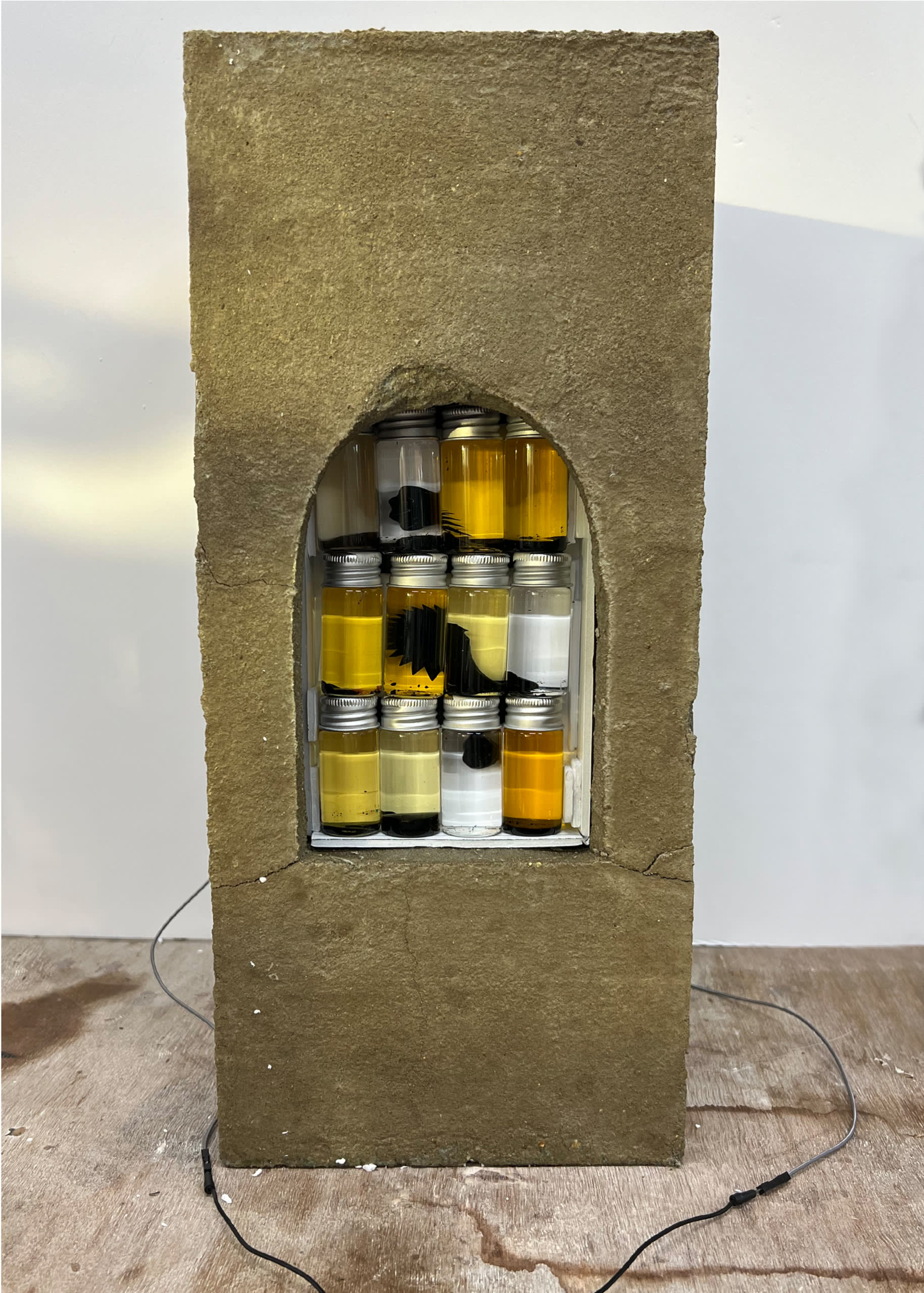 Subject <--> Matter Sculpture, Concrete box with window with vials of ferrofluid.