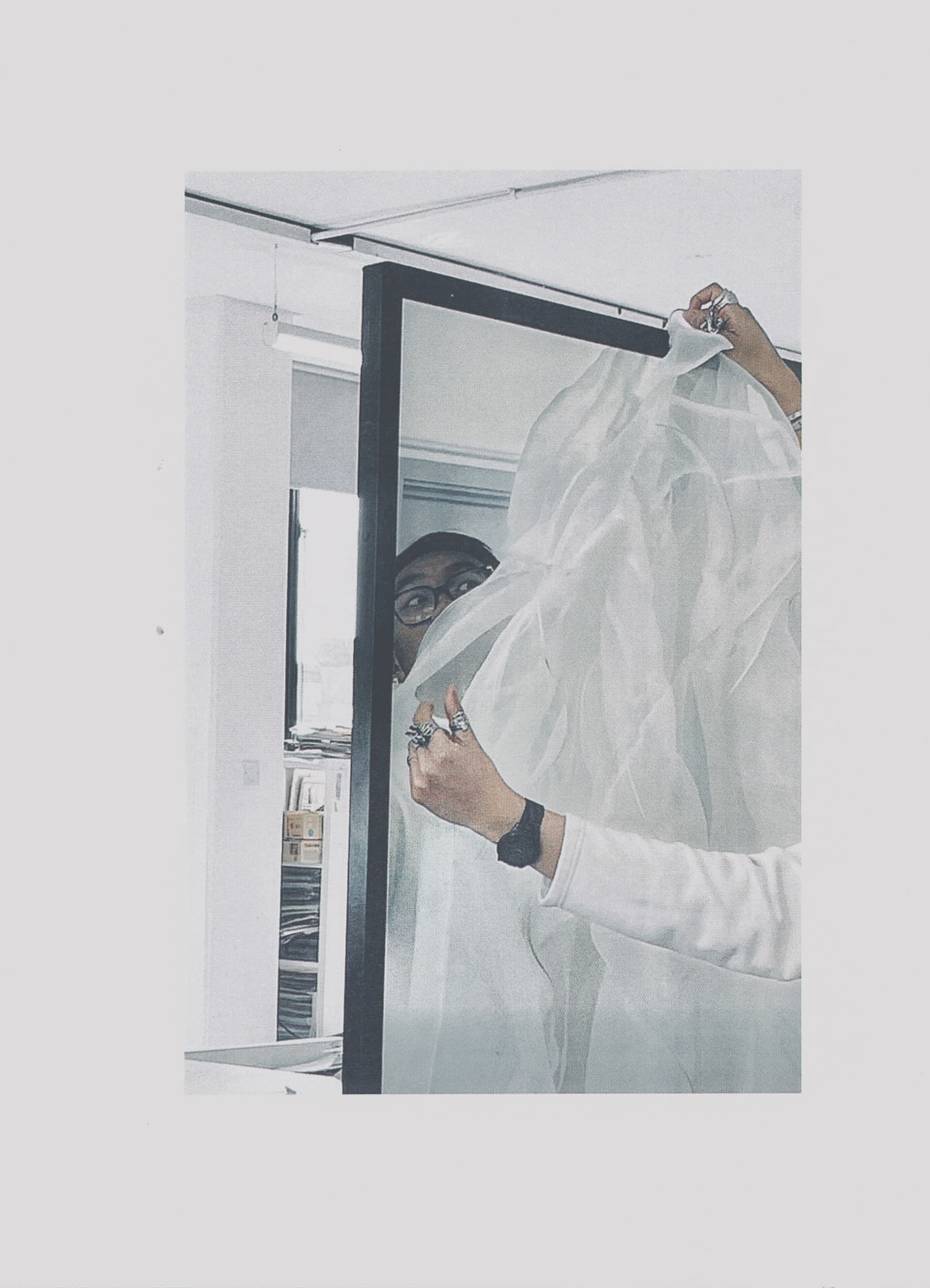 A photo of myself playing with materials looking through a mirror and asking a questions of who are you in Filipino. 