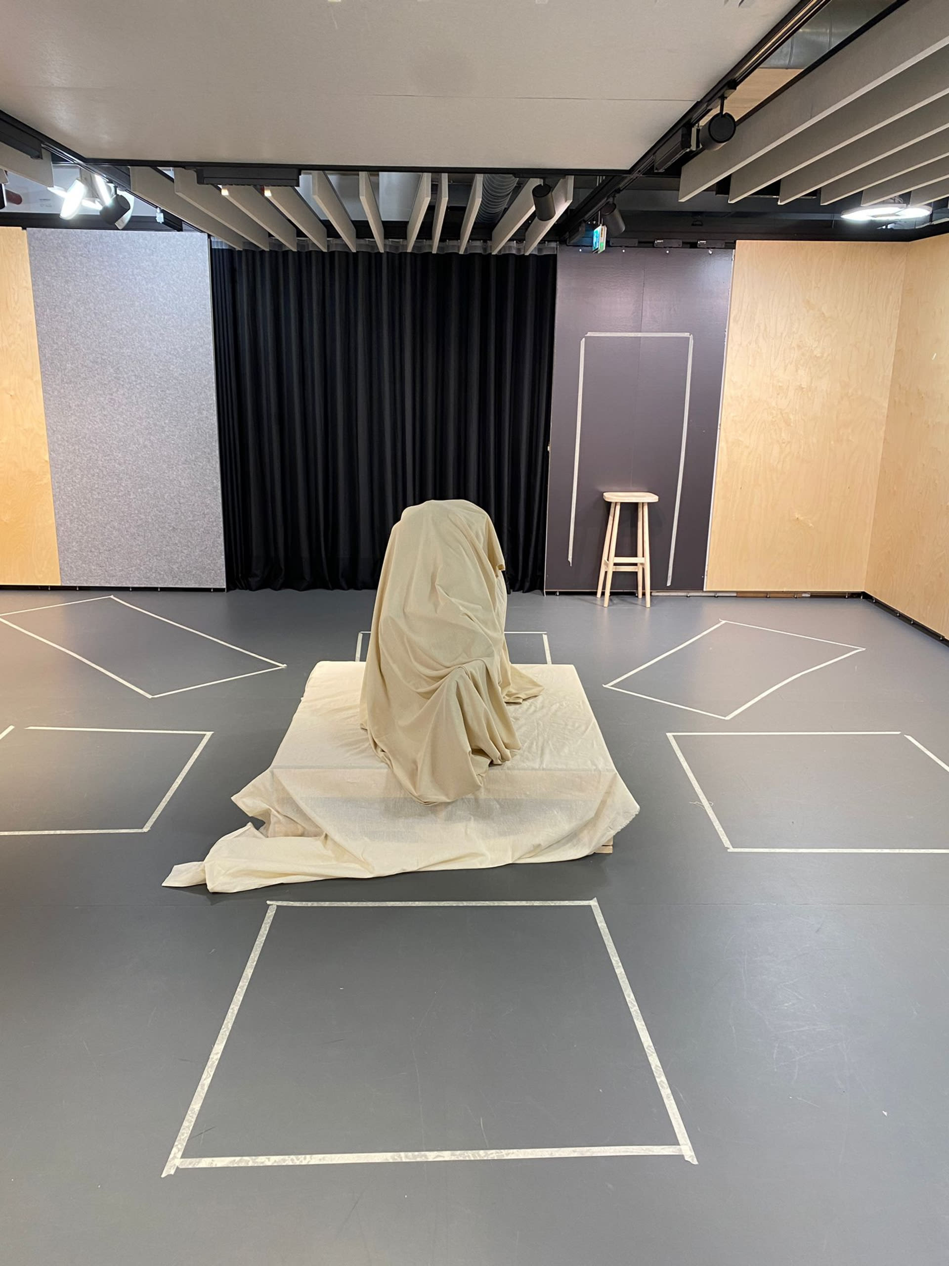 The performance staged space setup with the sculpture and the tape to define a space for understanding.