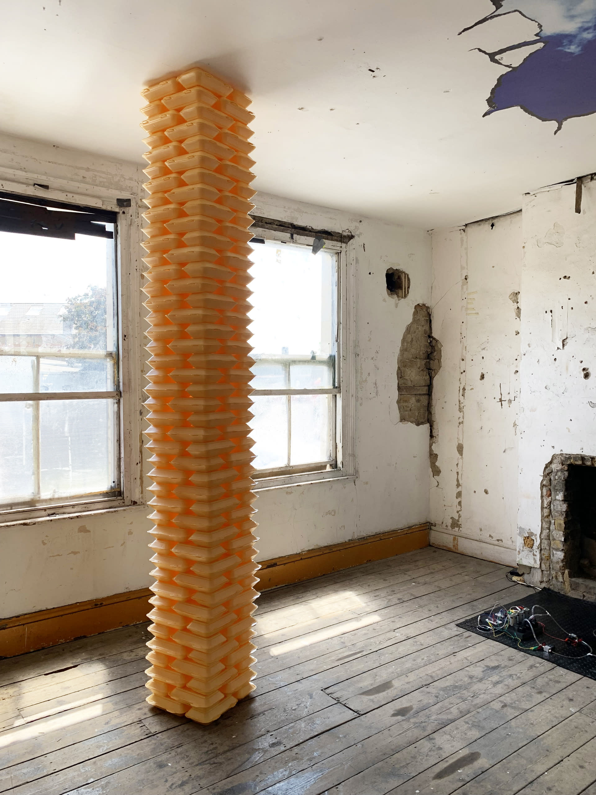 takeaway containers stacked as a pillar