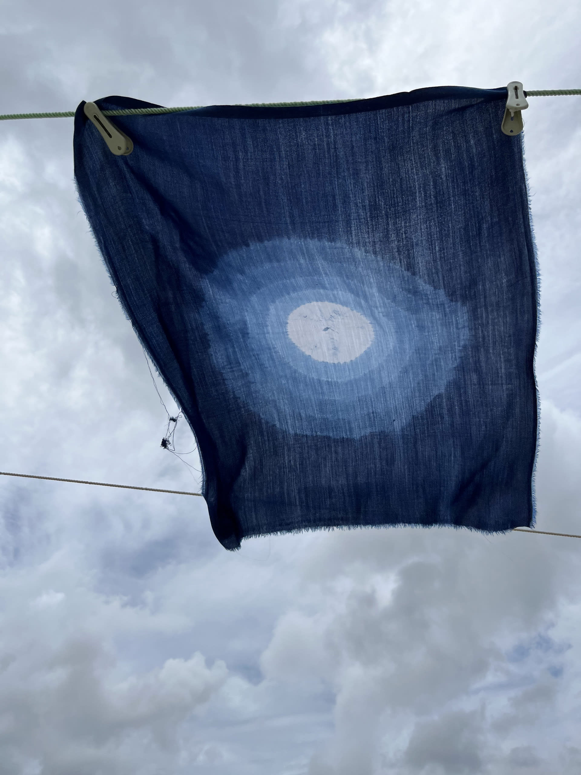 a contemporary demonstrative textile piece made using traditional techniques of Bandhej from India and dyed in Indigo