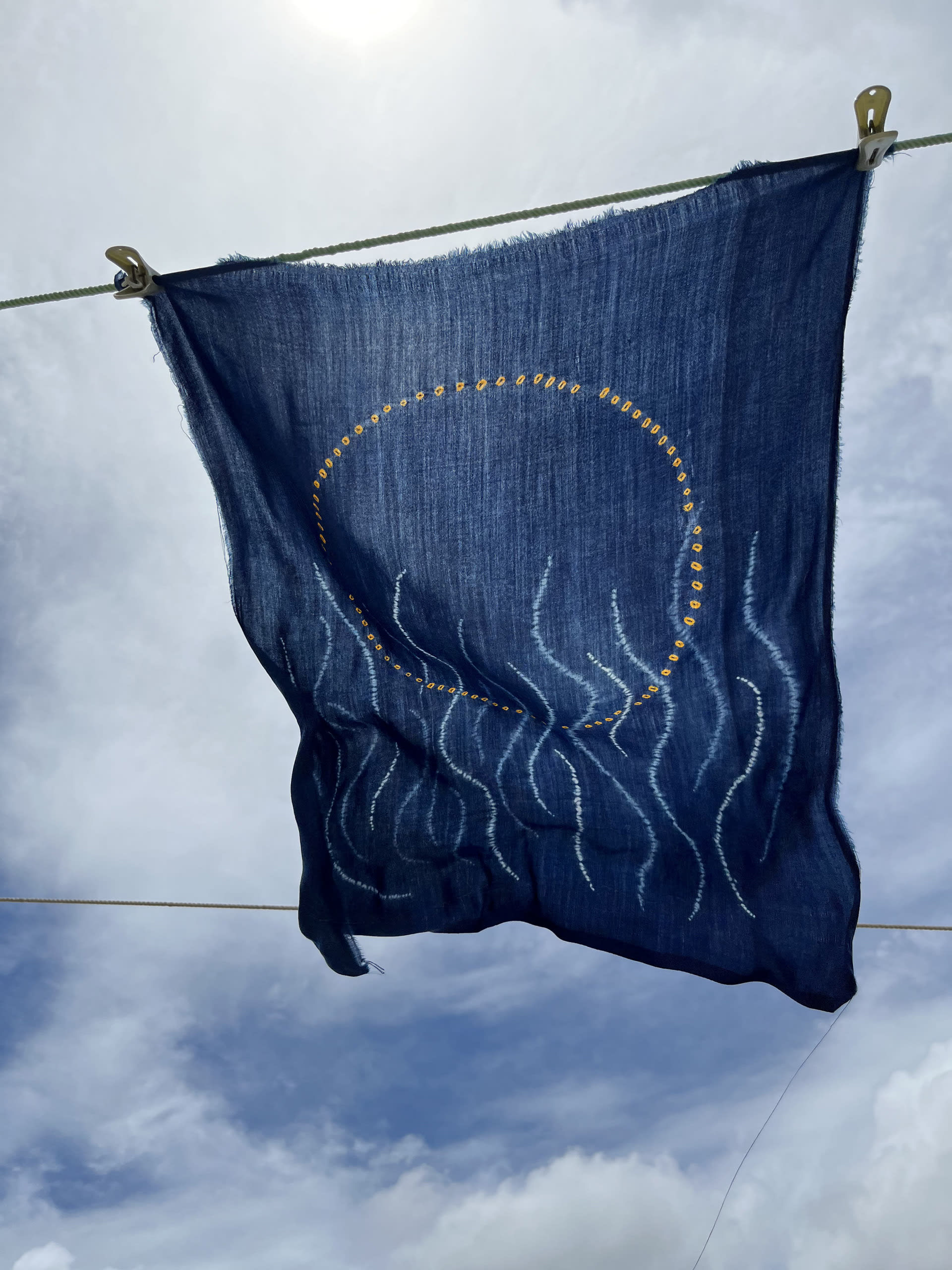 a contemporary demonstrative textile piece made using traditional techniques of Bandhej from India and dyed in Indigo