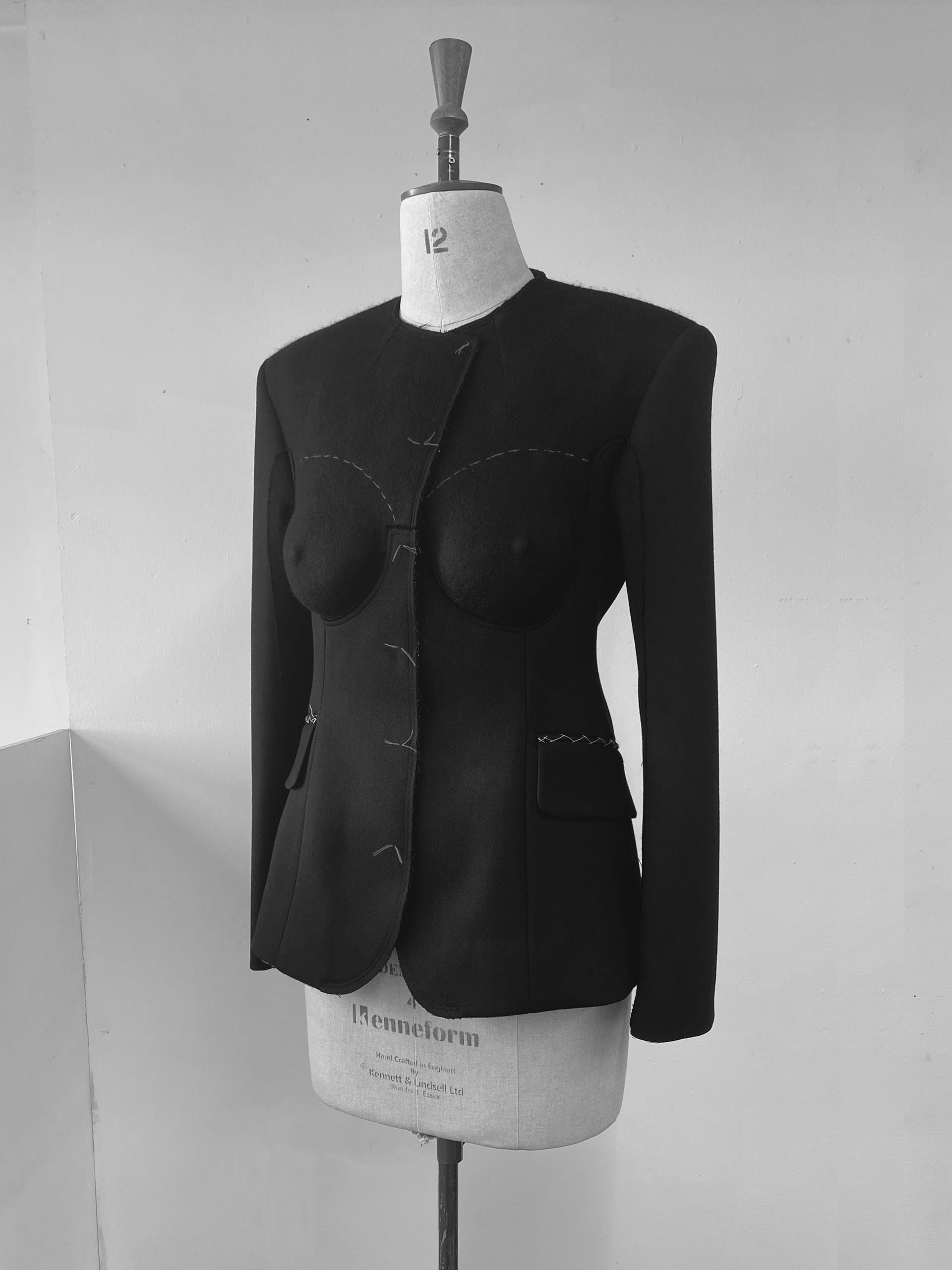 a black jacket on a mannequin