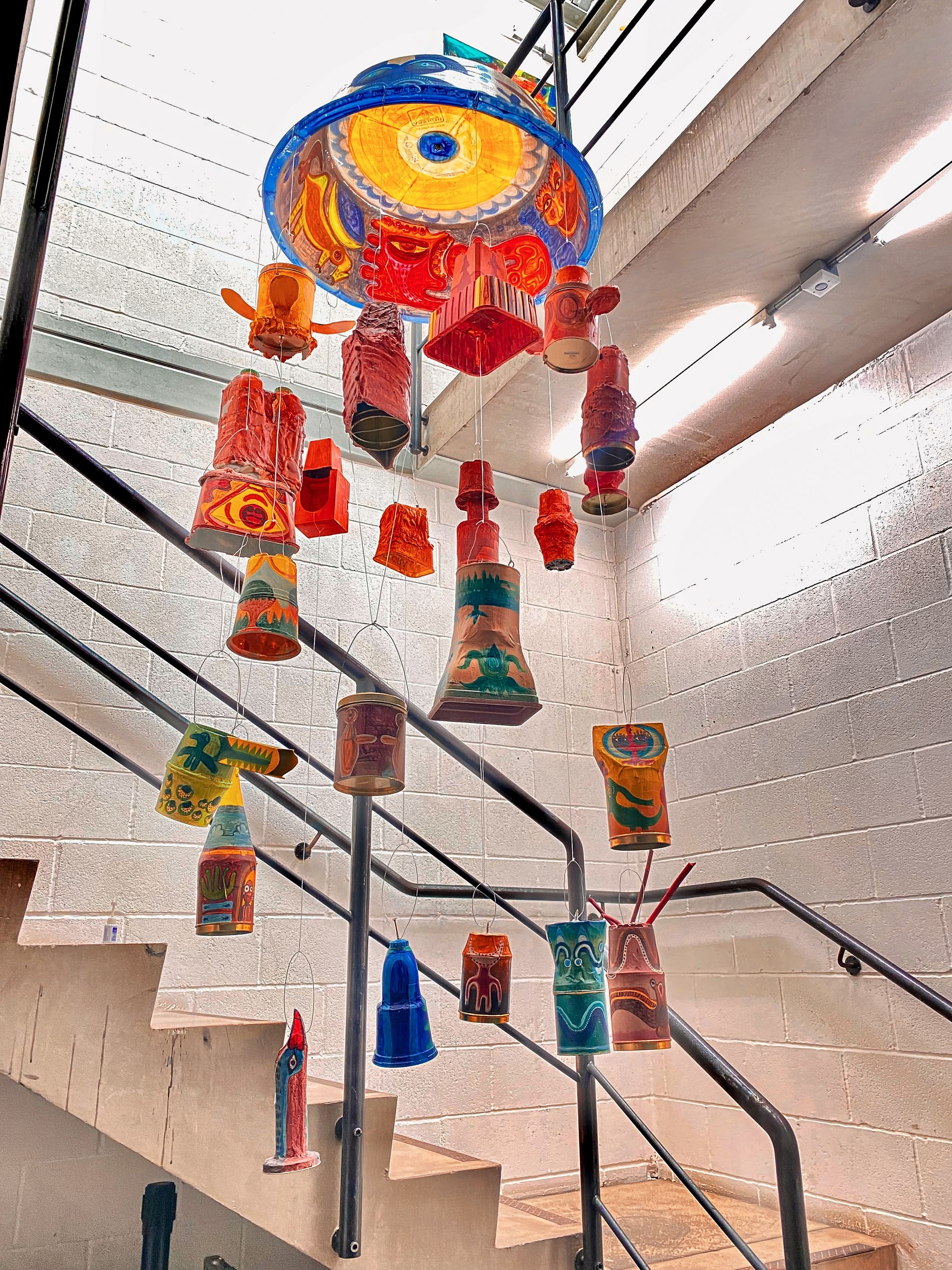 a group of colorful lanterns from a ceiling