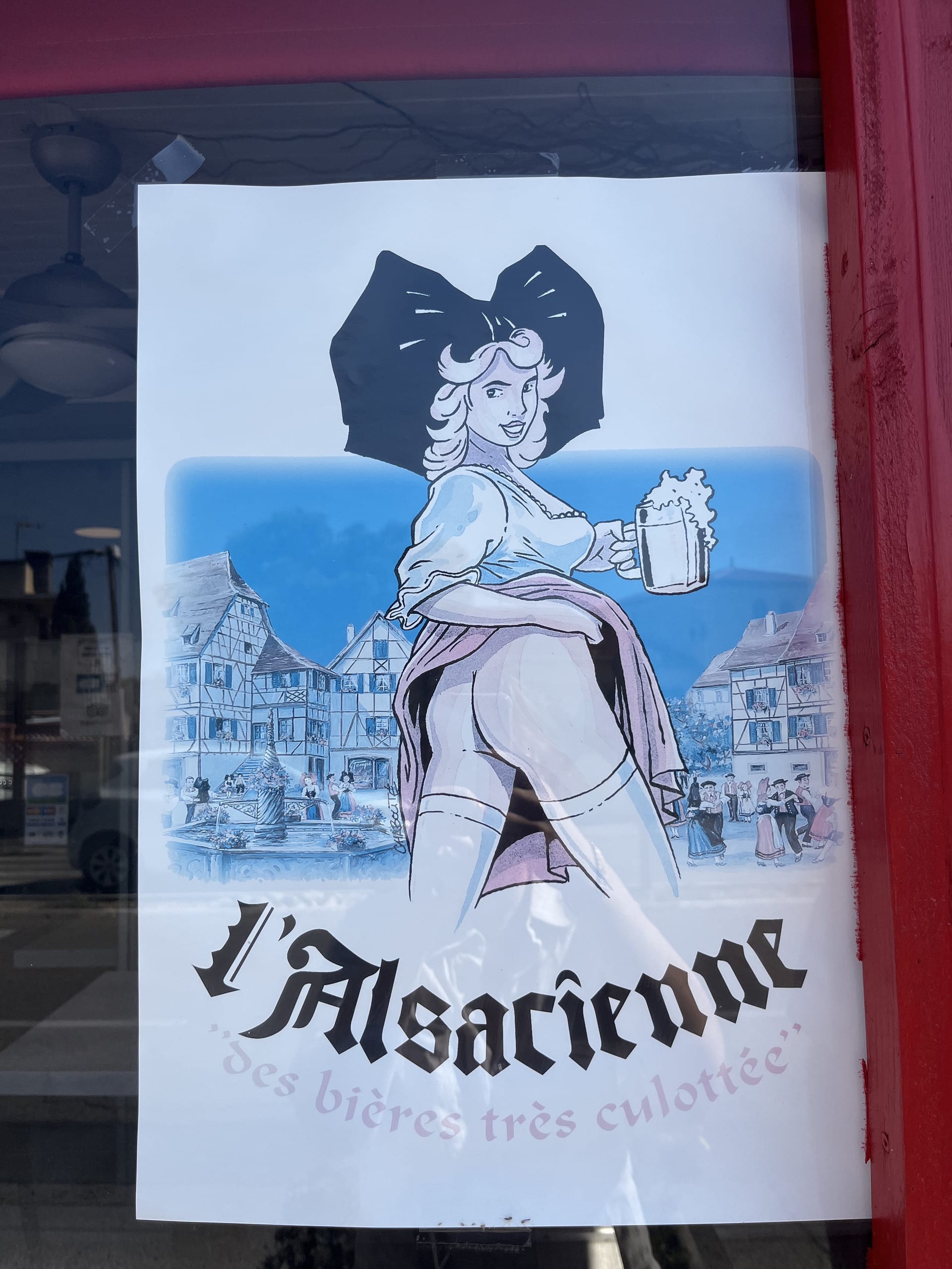 fresh poster advertising beer, a cartoon image of a woman holds a beer and shows her bare bum