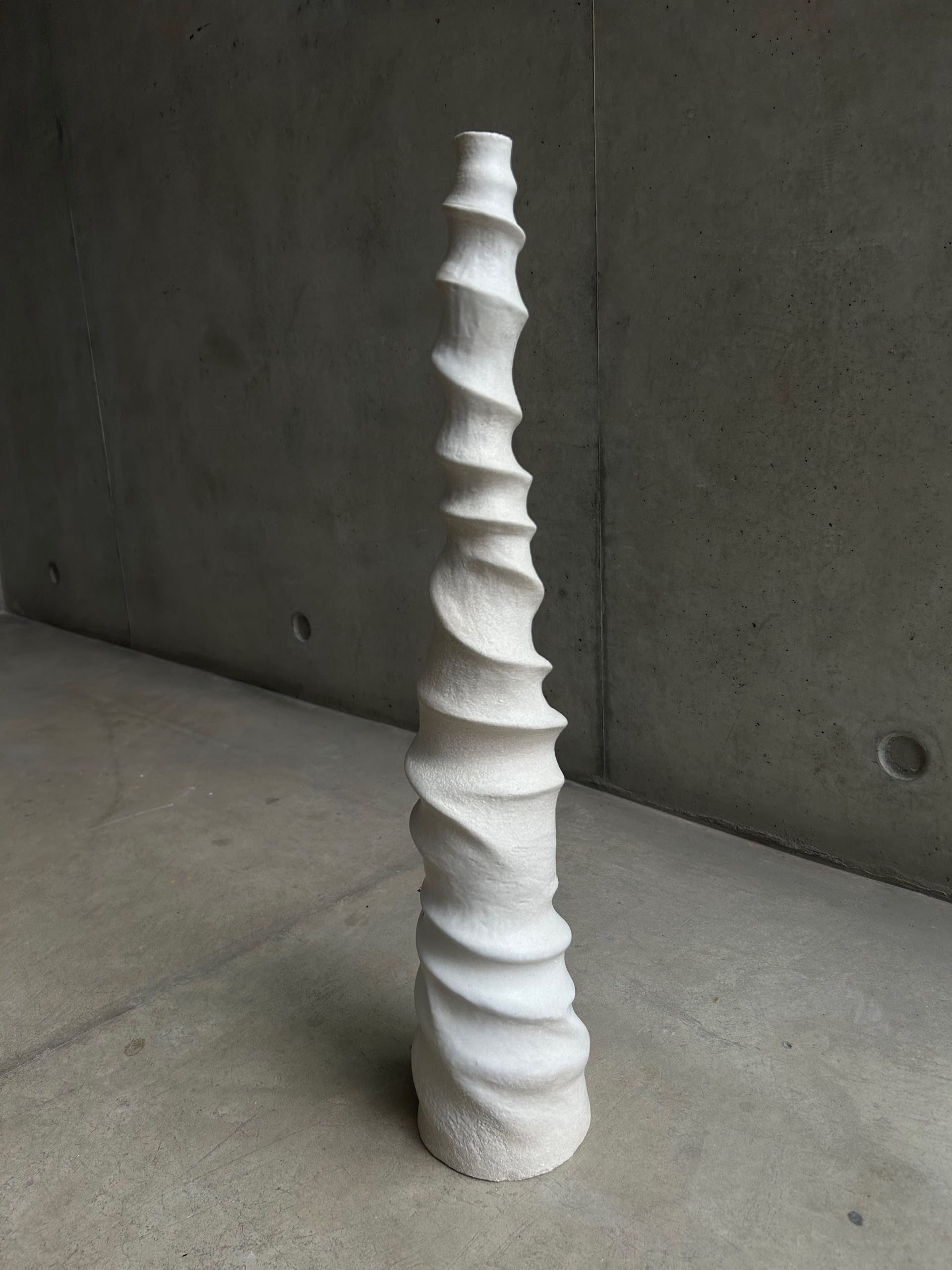 spiralling witch sculpture in artic white stoneware 