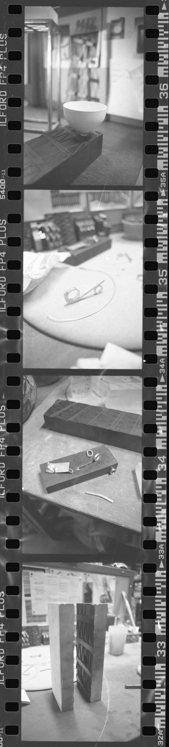 Scanned image of black and white negatives of work in progress shots, (silver ring making, metal working, pottery)