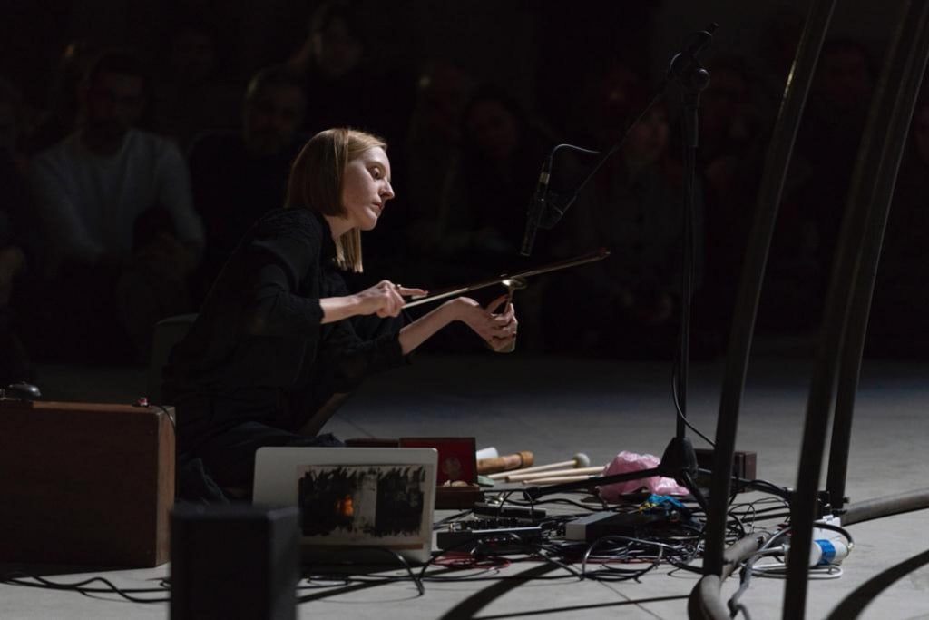 Lucie Stepankova preforming a live improvisation inside the 4DSOUND sound system, 2023. Image courtesy of Pirelli HangarBicocca 