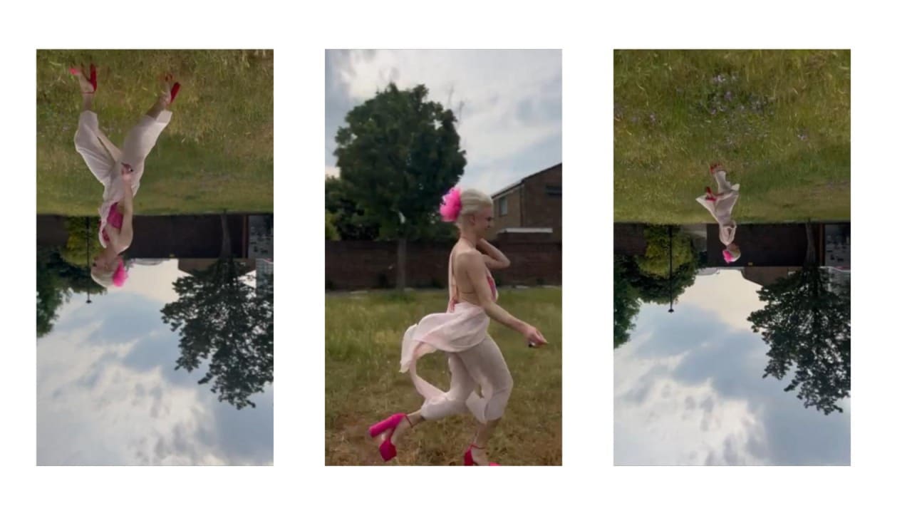person running in a pink jumpsuit over a field