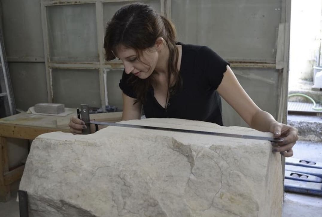 Sofia measuring an ancient marble fragment for the Parthenon Restoration Project. Measurements were taken for technical drawings