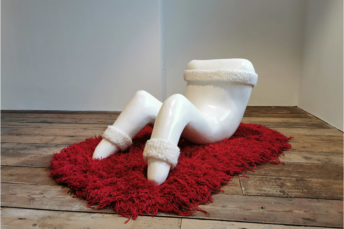 Anthropomorphised Jesmonite tooth performing sit-ups on a red hand-tufted rug.