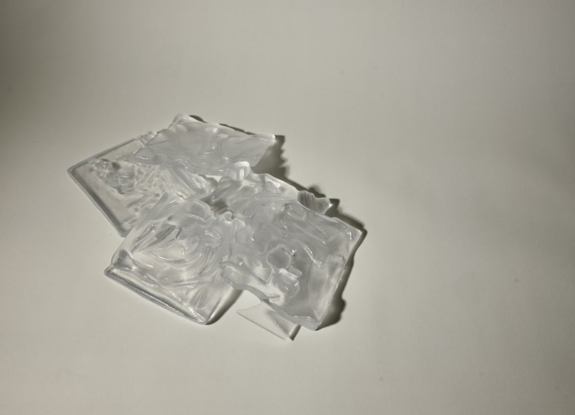 5 pieces of glass cast kept on top of each other 