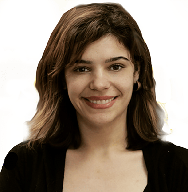 Pictured is a smiling brunette with shoulder length hair smiling directly at the camera 