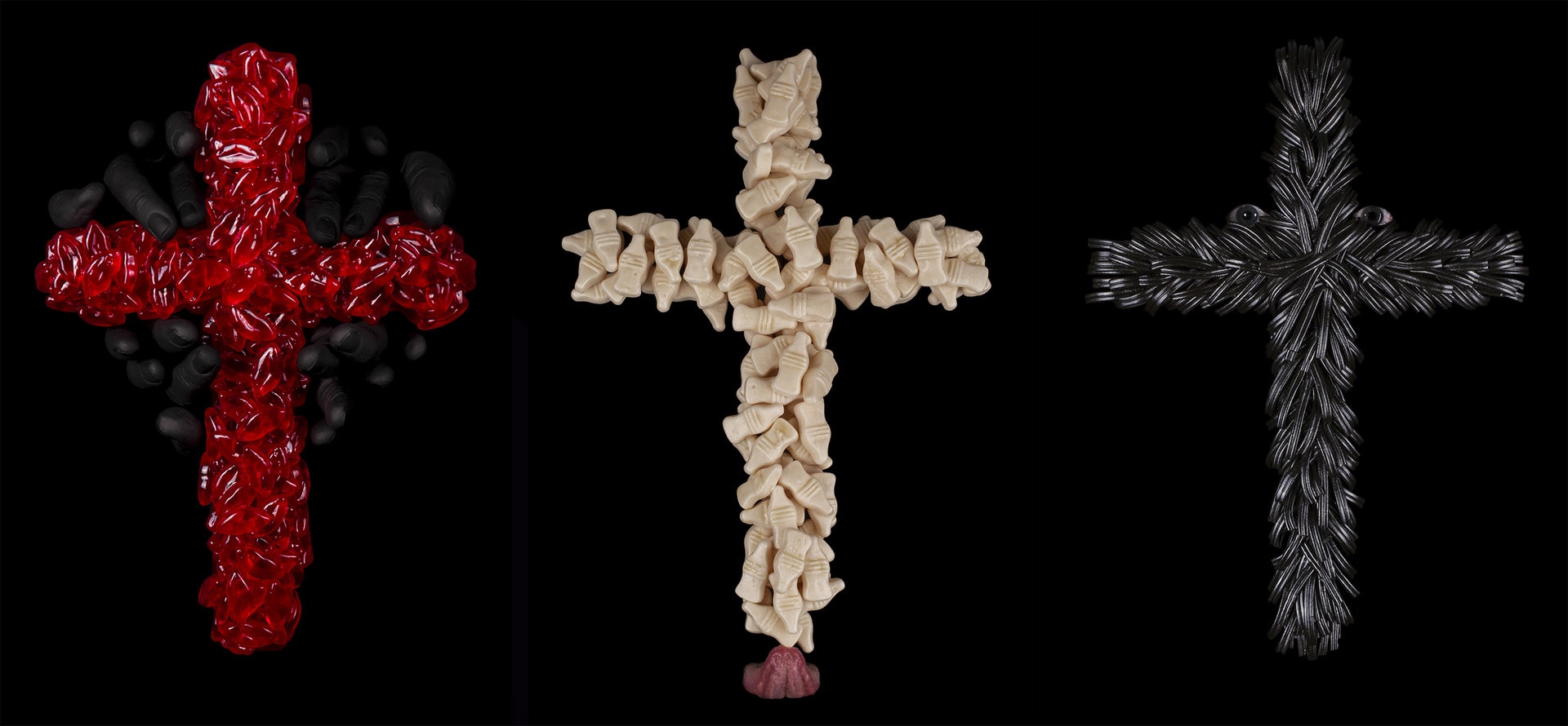 Three crosses made using sweets. Includes fingers, tongue, and eyes